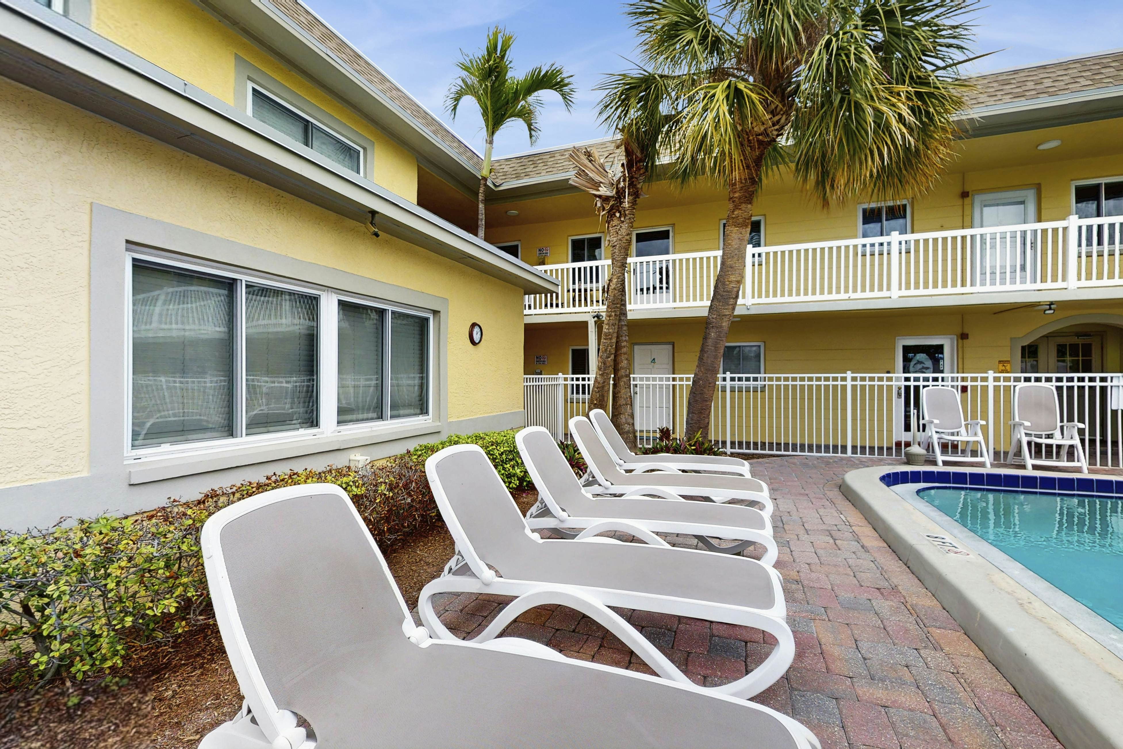 Ground-floor getaway with a heated pool & central AC - walk to the beach
