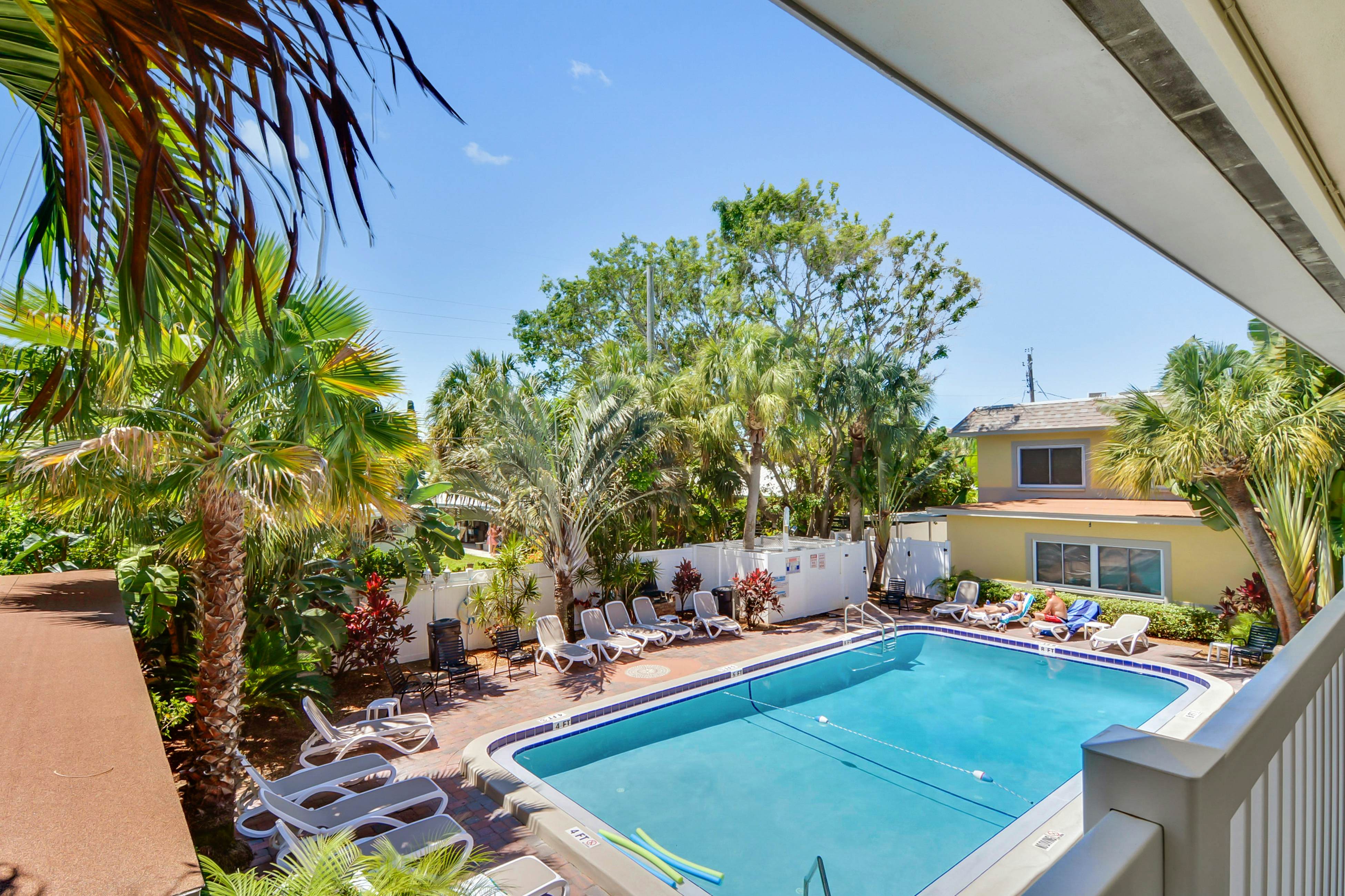 Ground-floor getaway with a heated pool & central AC - walk to the beach