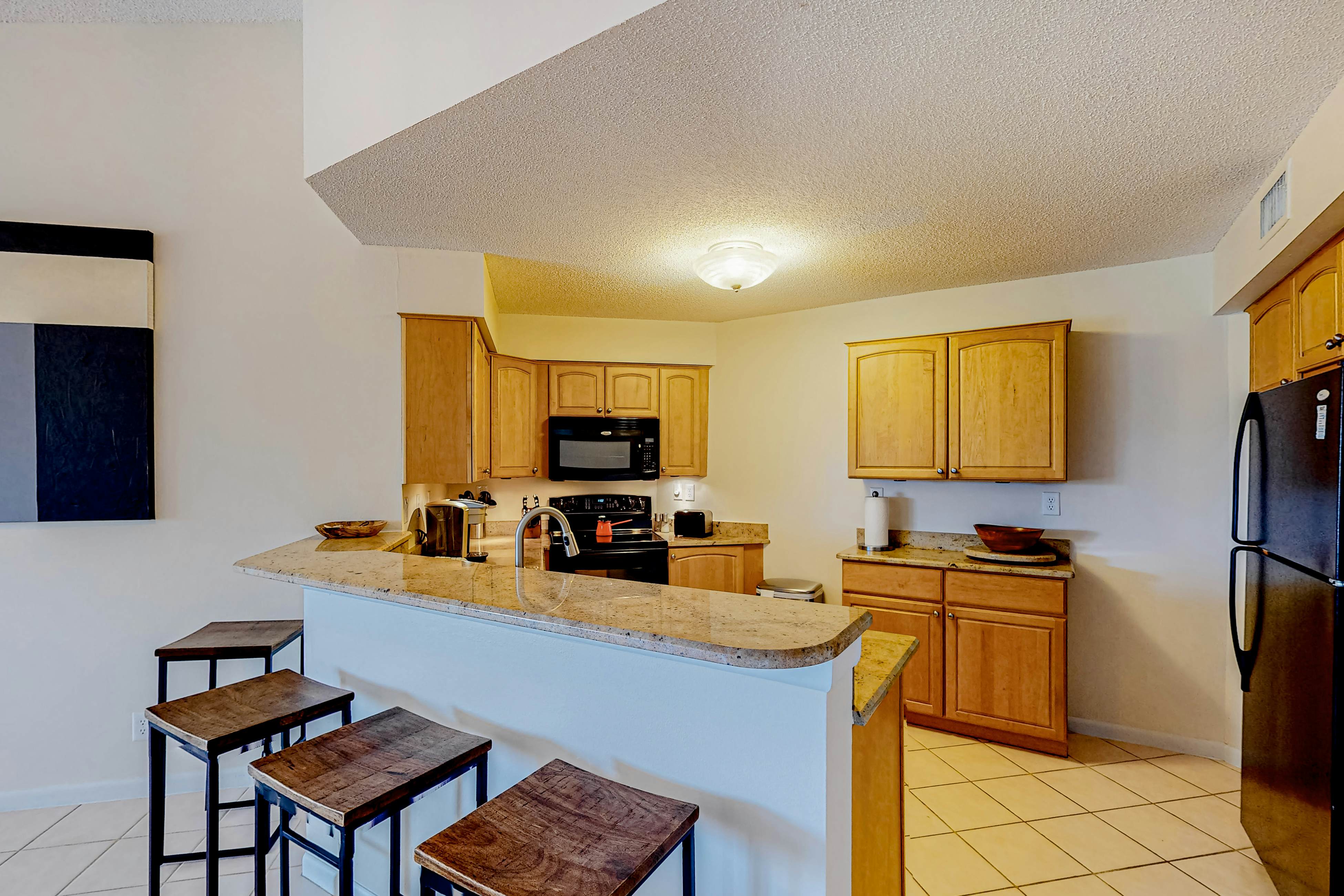 2nd-Floor Condo Overlooking Country Club Greens w/Free WiFi, AC, and Shared Pool