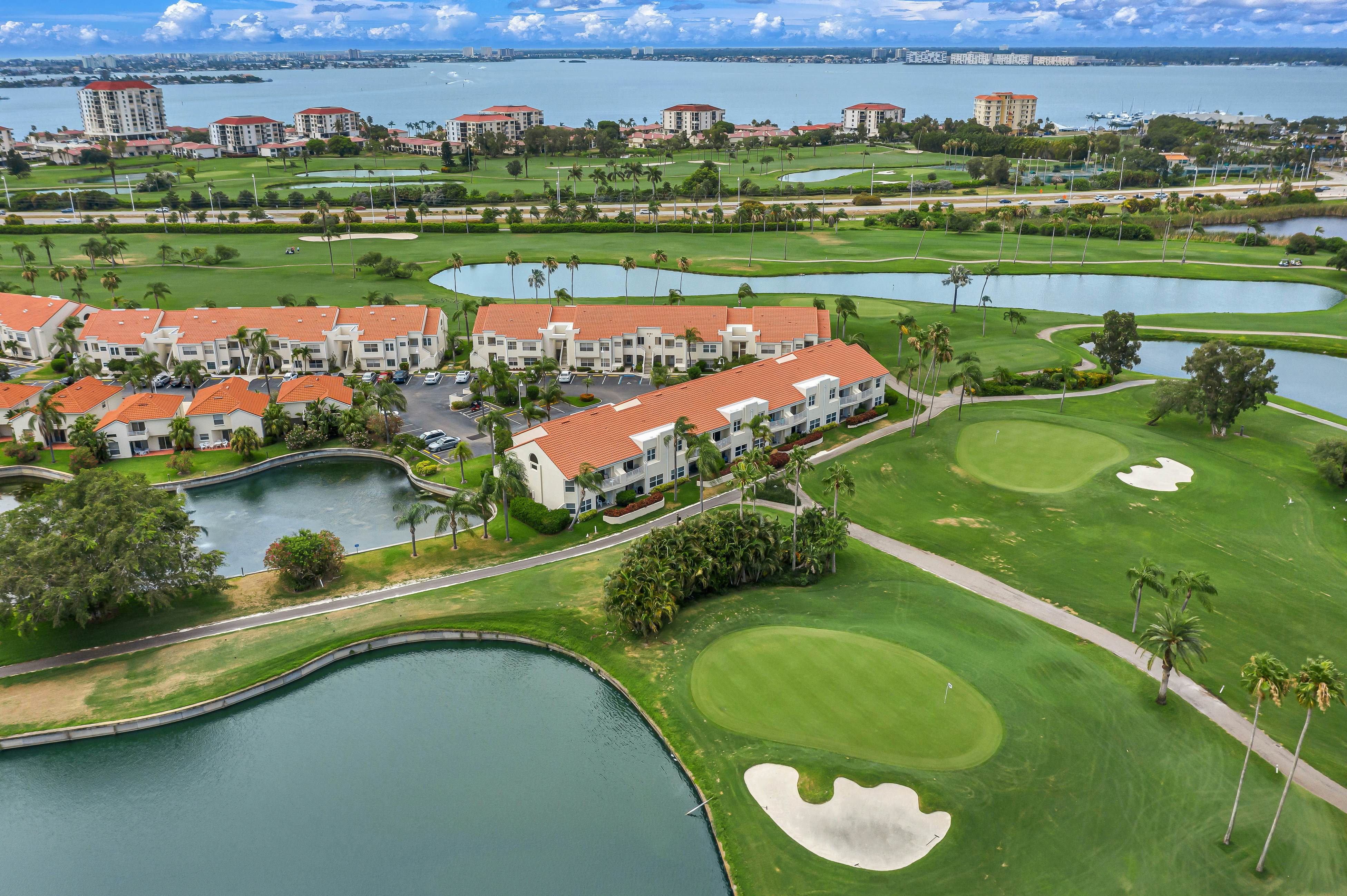 2nd-Floor Condo Overlooking Country Club Greens w/Free WiFi, AC, and Shared Pool