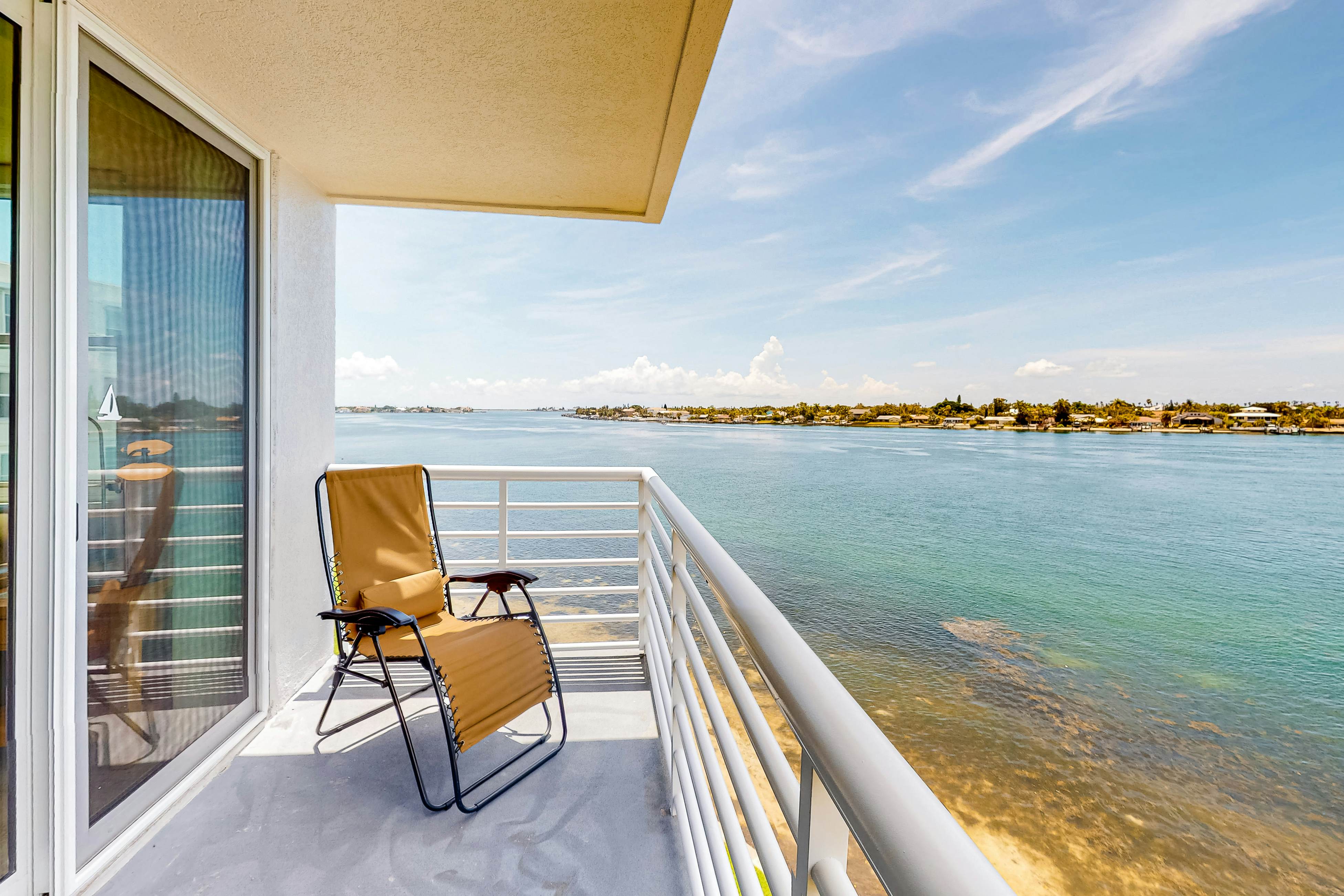 Water view condo with private beach pool and hot tub snowbird friendly