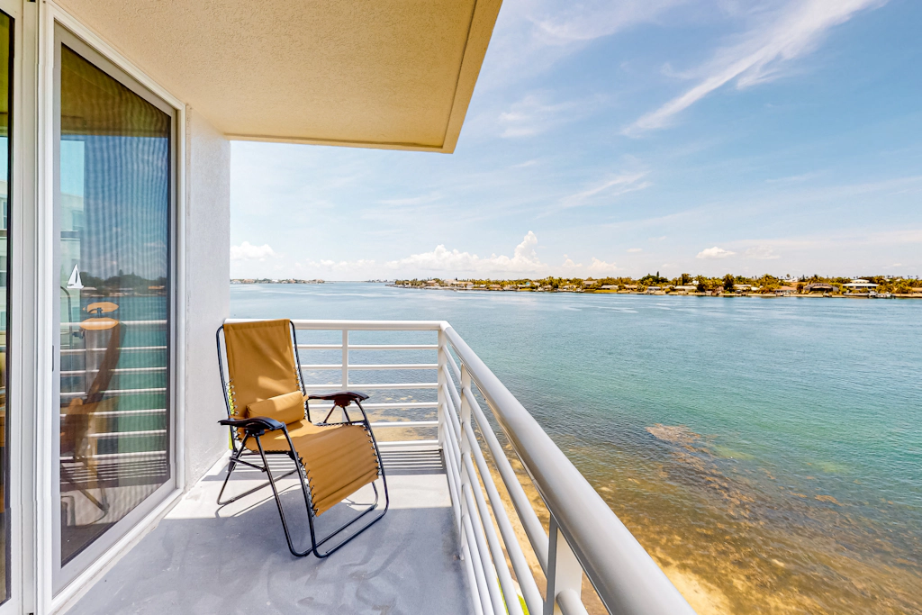 Water view condo with private beach pool and hot tub snowbird friendly