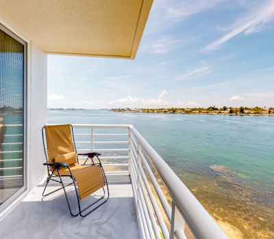 Water view condo with private beach pool and hot tub snowbird friendly