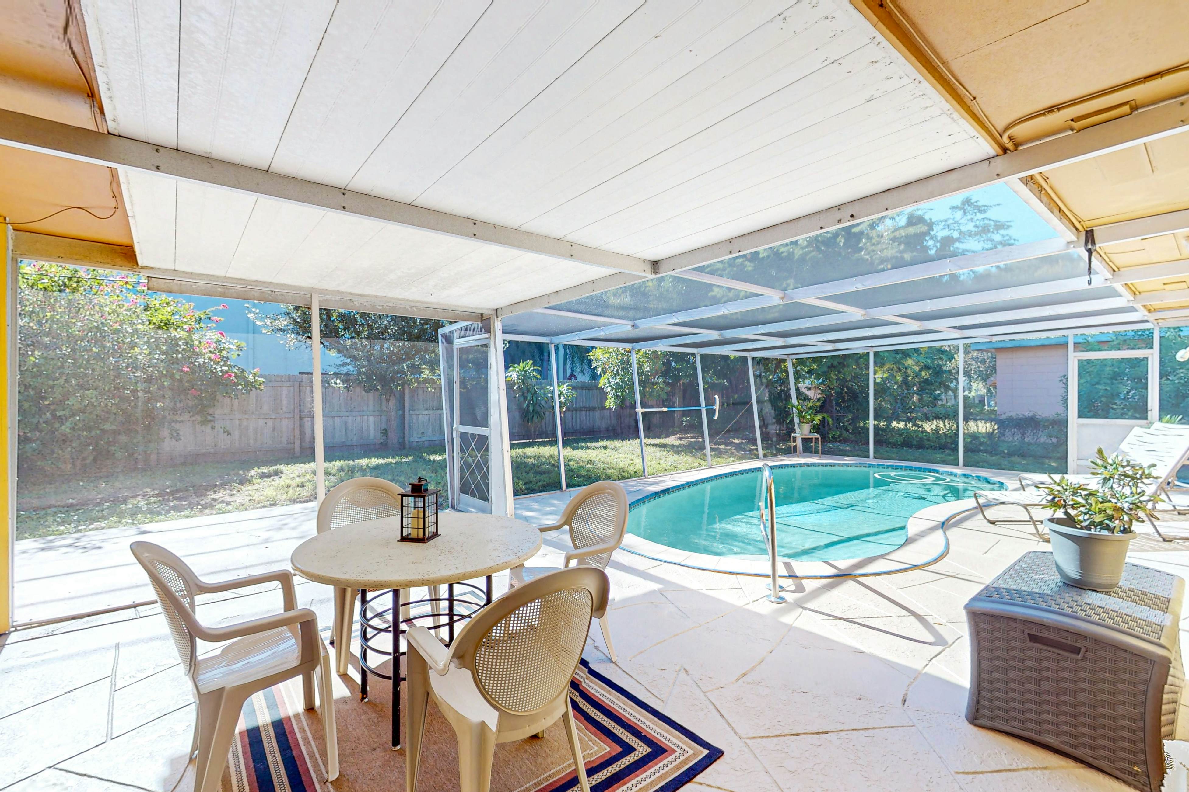 Single story home near beach with heated private pool enclosed yard Dogs ok