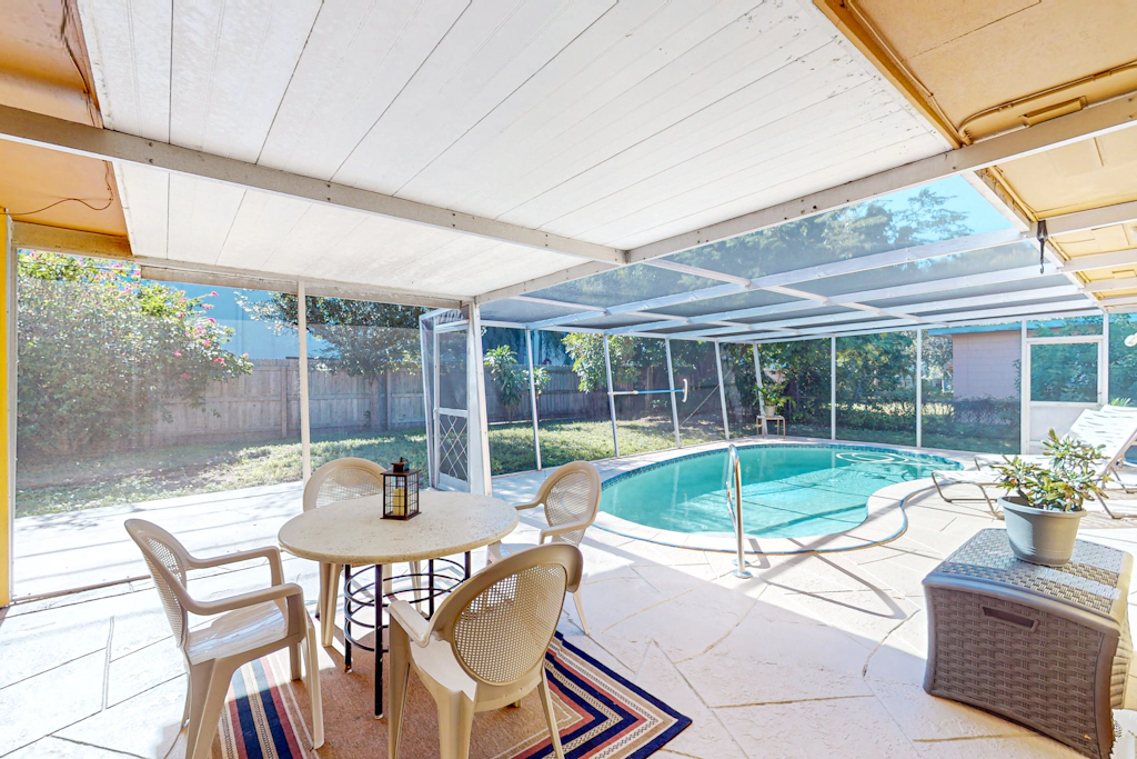 Single story home near beach with heated private pool enclosed yard Dogs ok