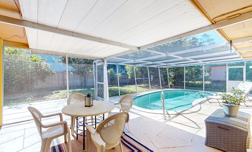 Single story home near beach with heated private pool enclosed yard Dogs ok