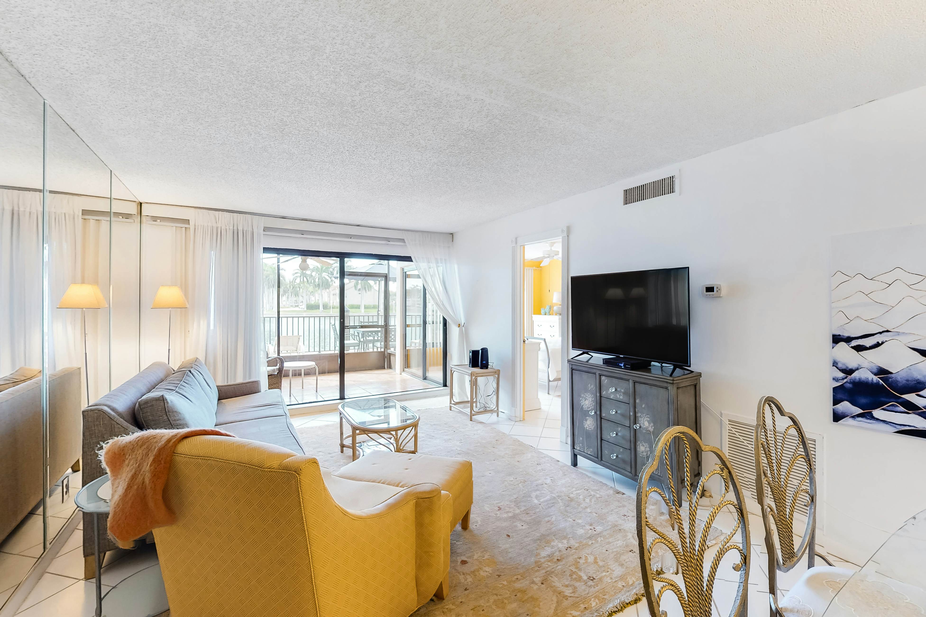 Lakefront resort condo with furnished deck, heated pool, pool spa, & tennis