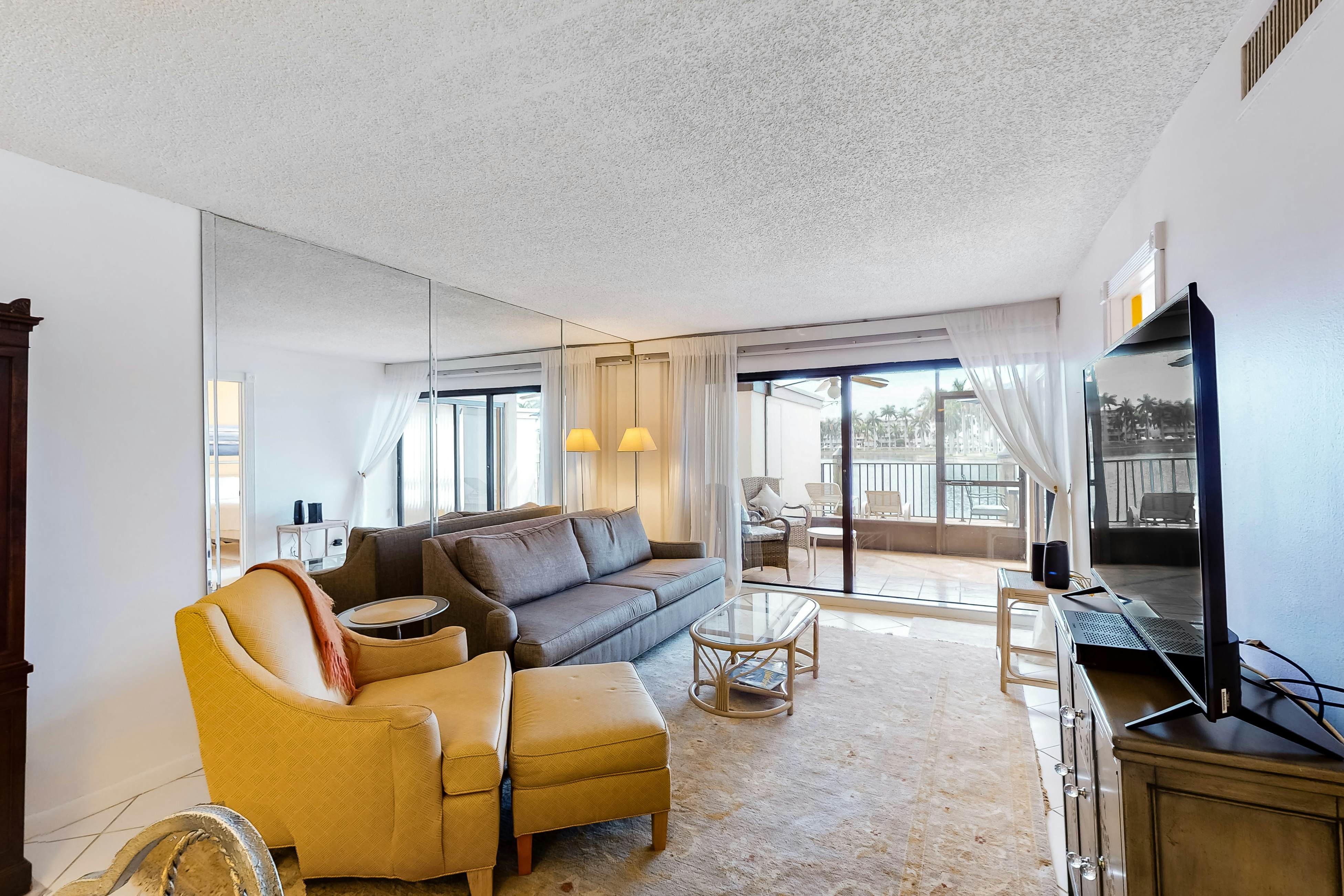 Lakefront resort condo with furnished deck, heated pool, pool spa, & tennis