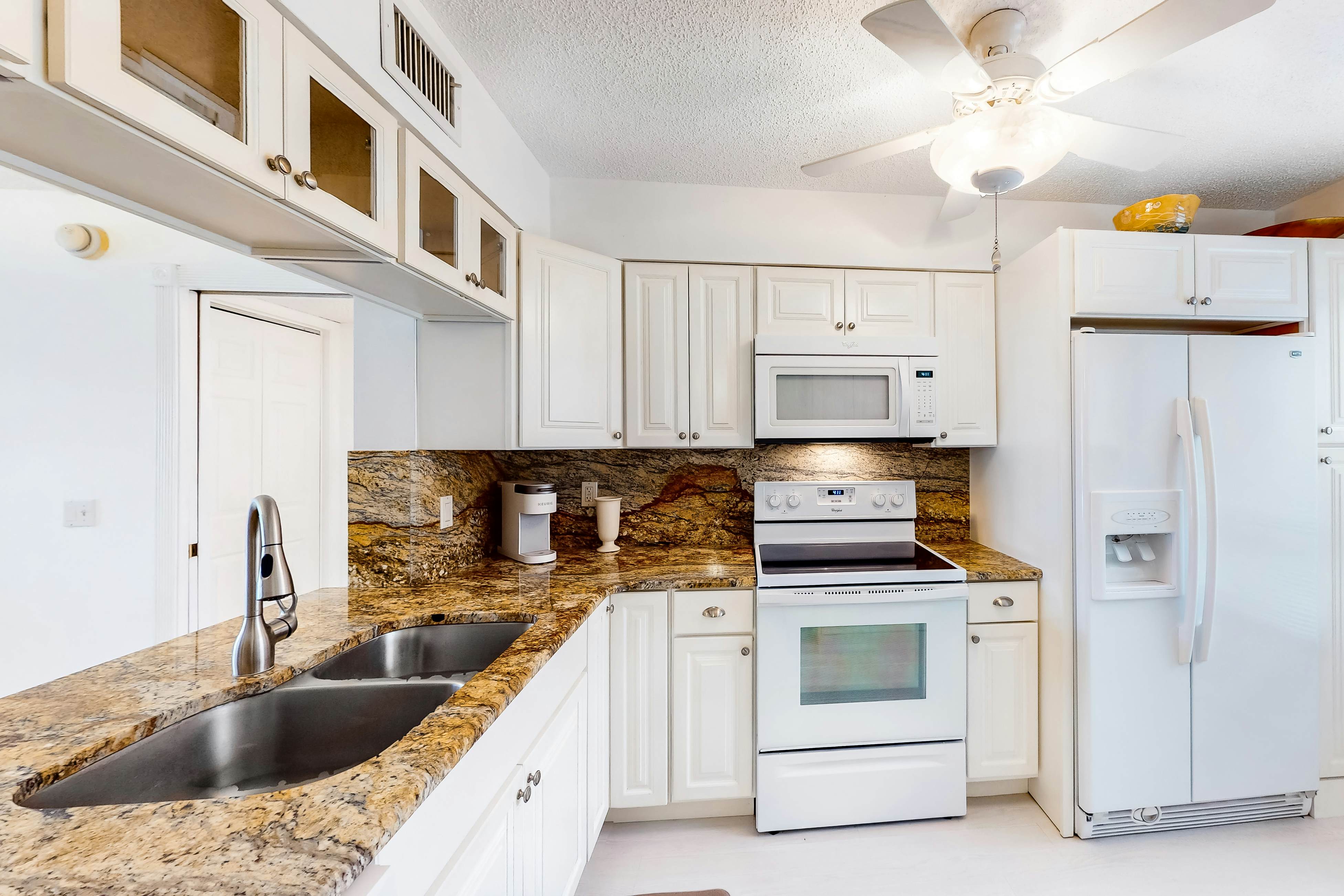 Lakefront resort condo with furnished deck, heated pool, pool spa, & tennis