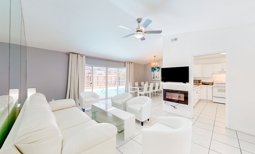 Coastal home with pool lanai patio and fireplace