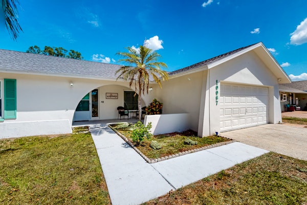 Coastal home with pool lanai patio and fireplace