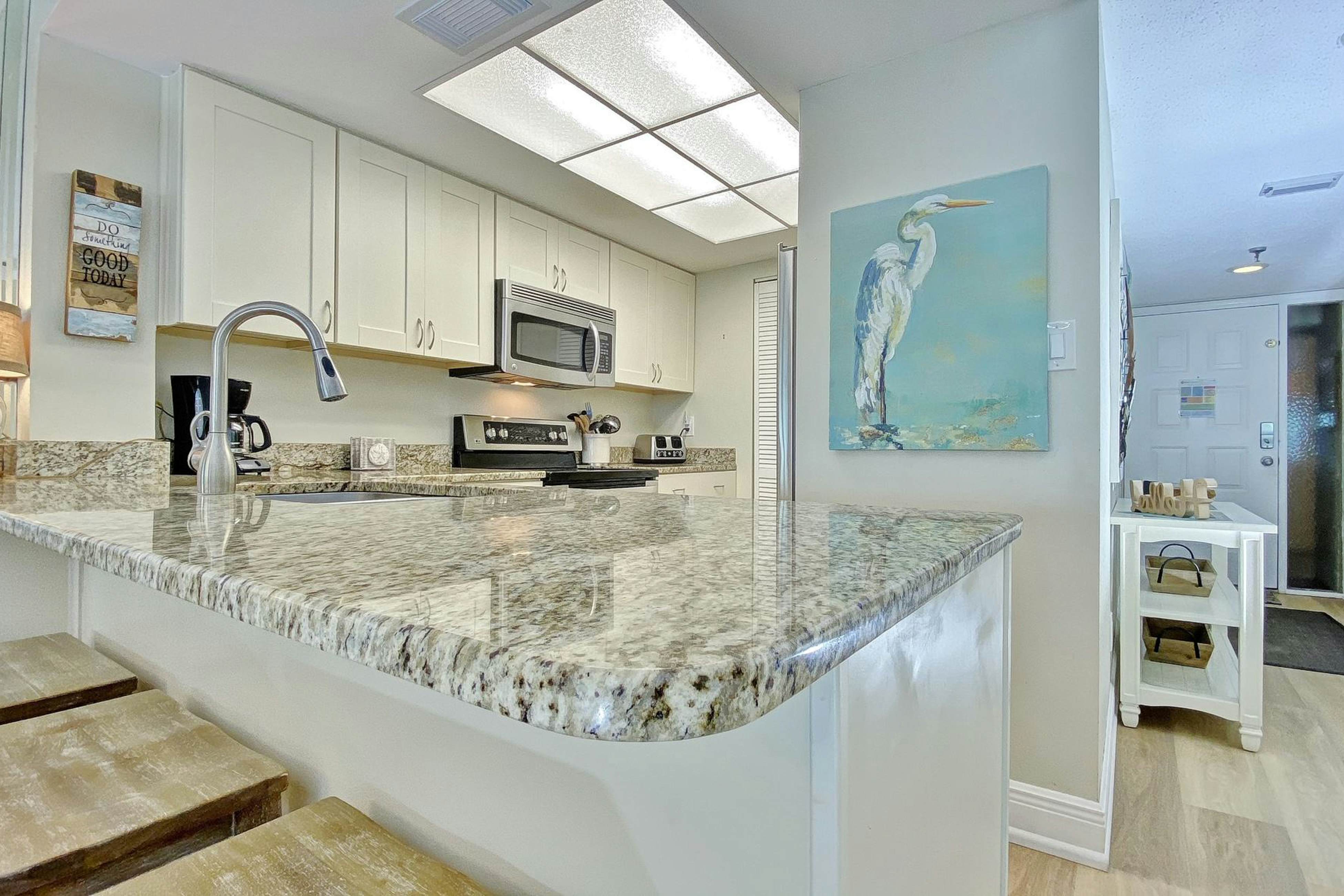 Peaceful beachfront escape w/private balcony, heated pool, pool spa, BBQ grills