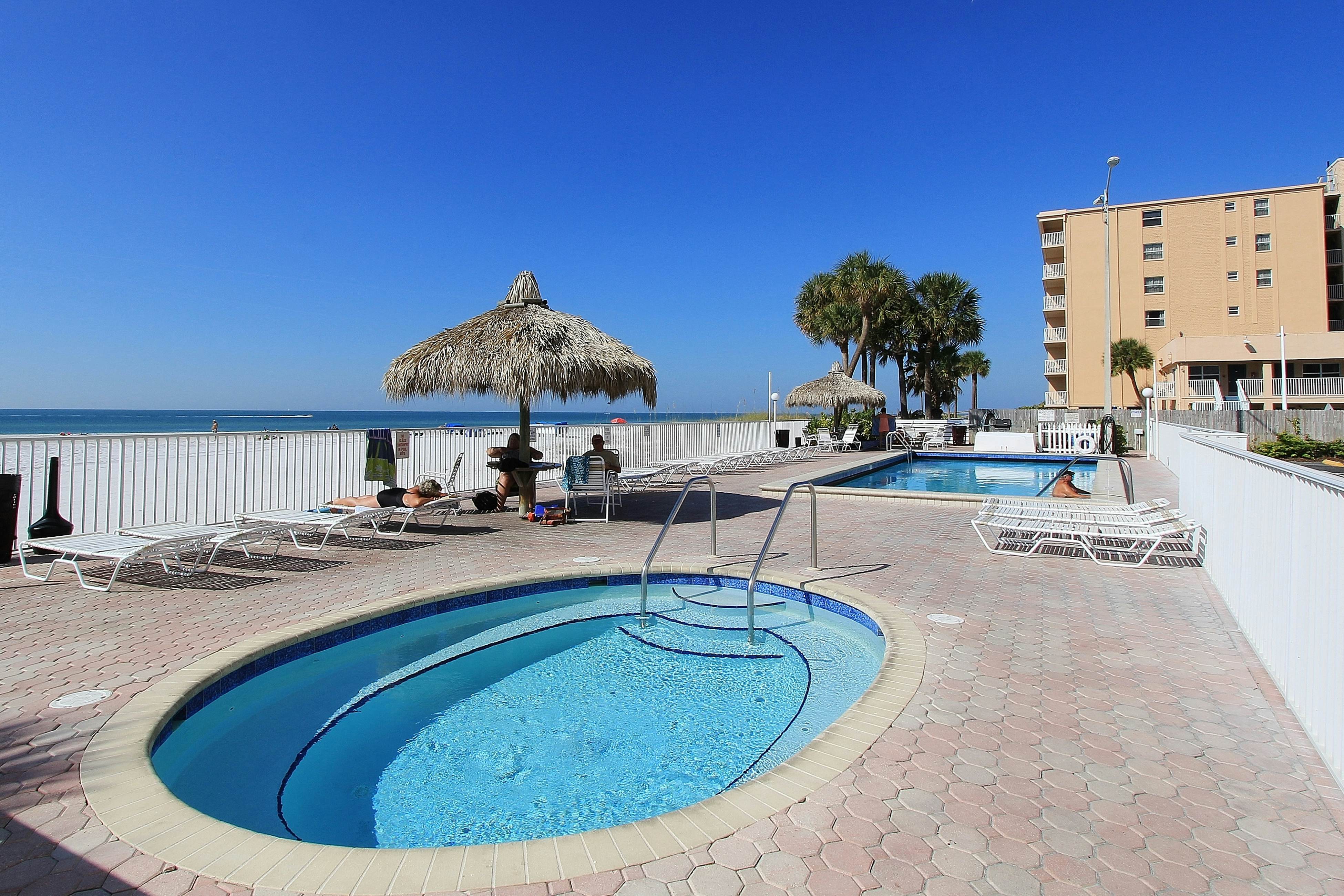 Upscale, beachfront condo with dual balconies, Gulf view, pool, hot tub & bocce