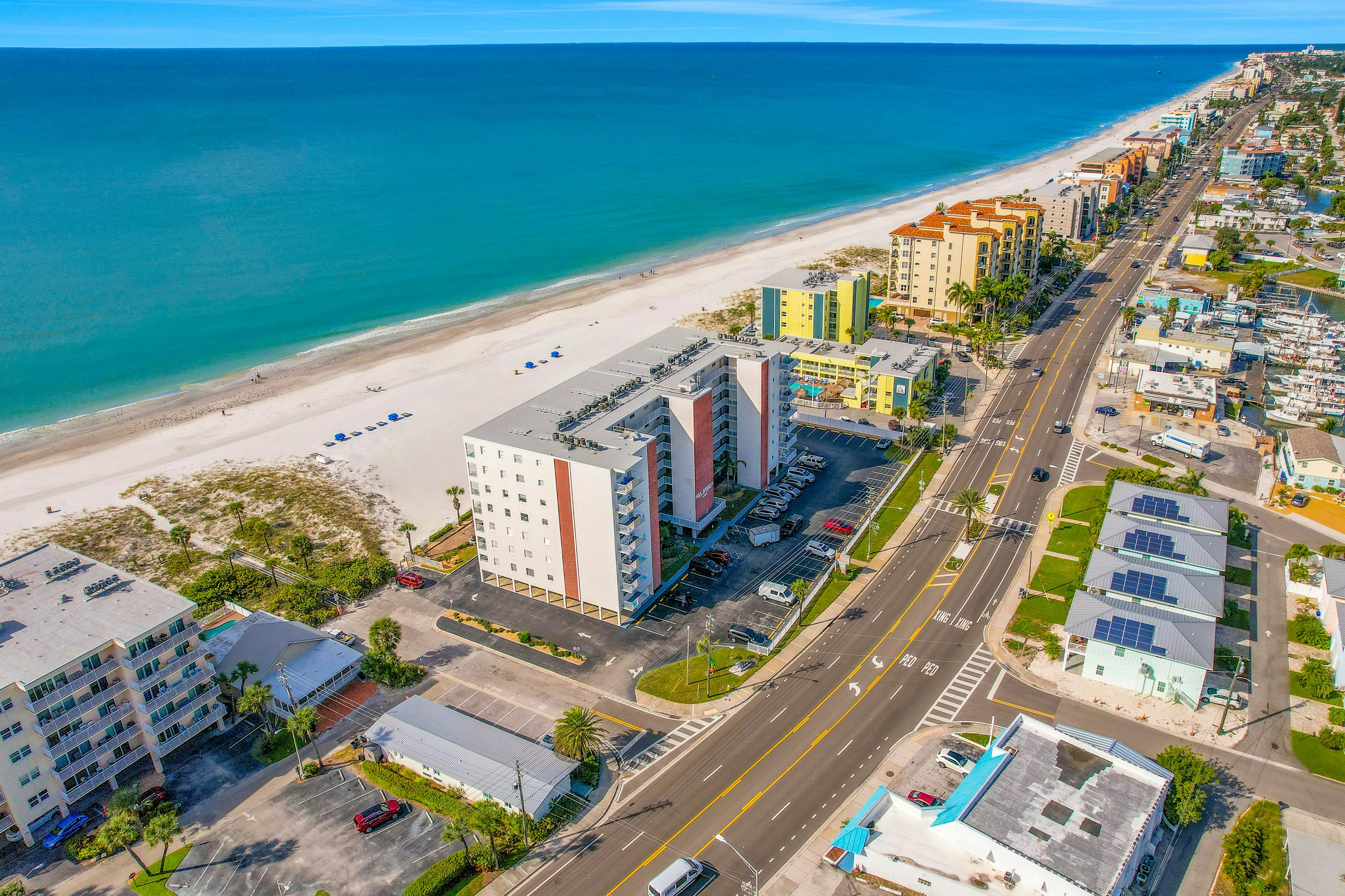 Upscale, beachfront condo with dual balconies, Gulf view, pool, hot tub & bocce