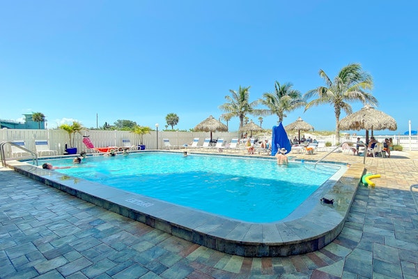 Newly renovated condo w private balcony gas grill and on site heated pool AC