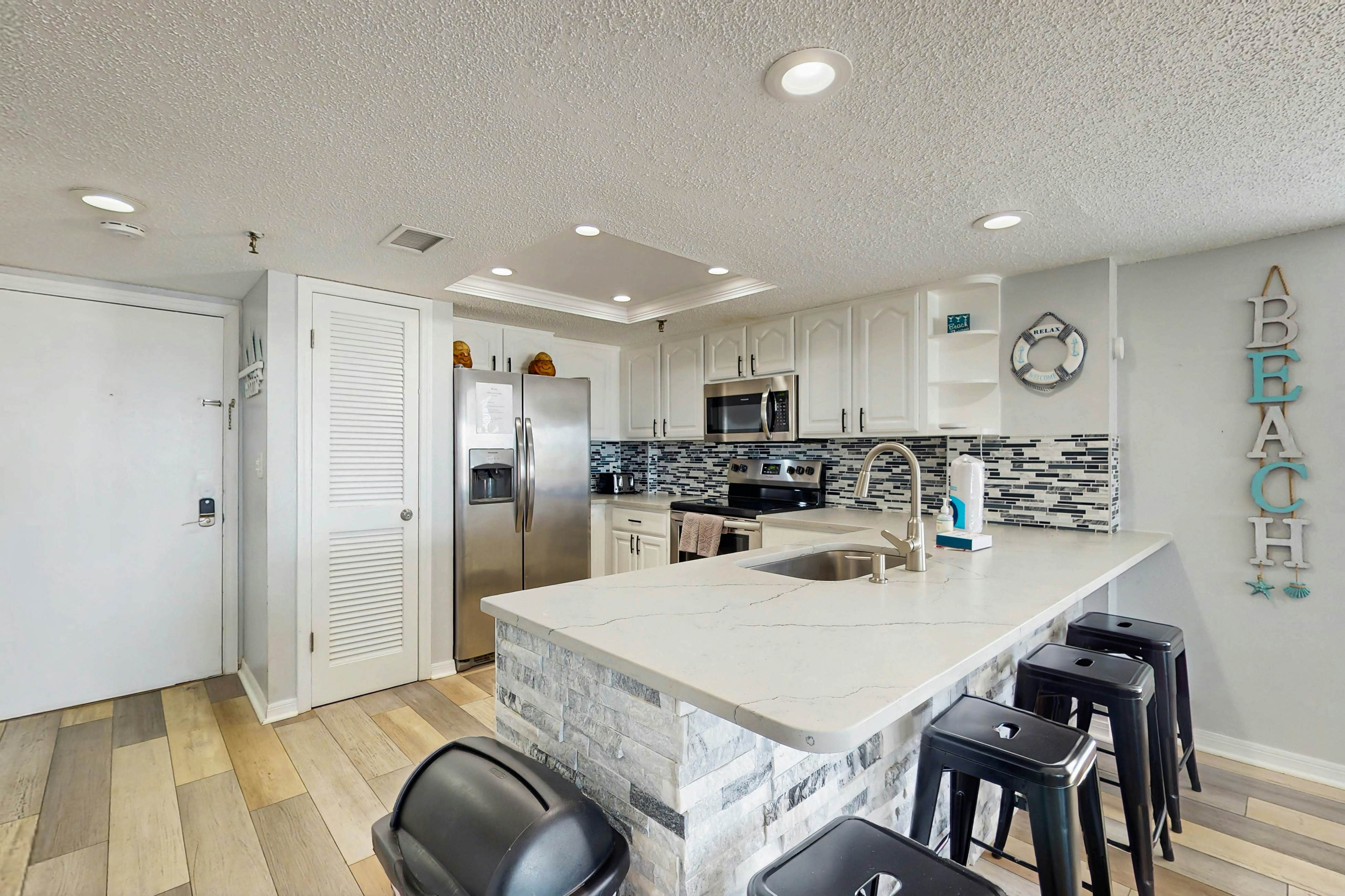 Newly renovated condo w/private balcony, gas grill, & on-site heated pool, AC