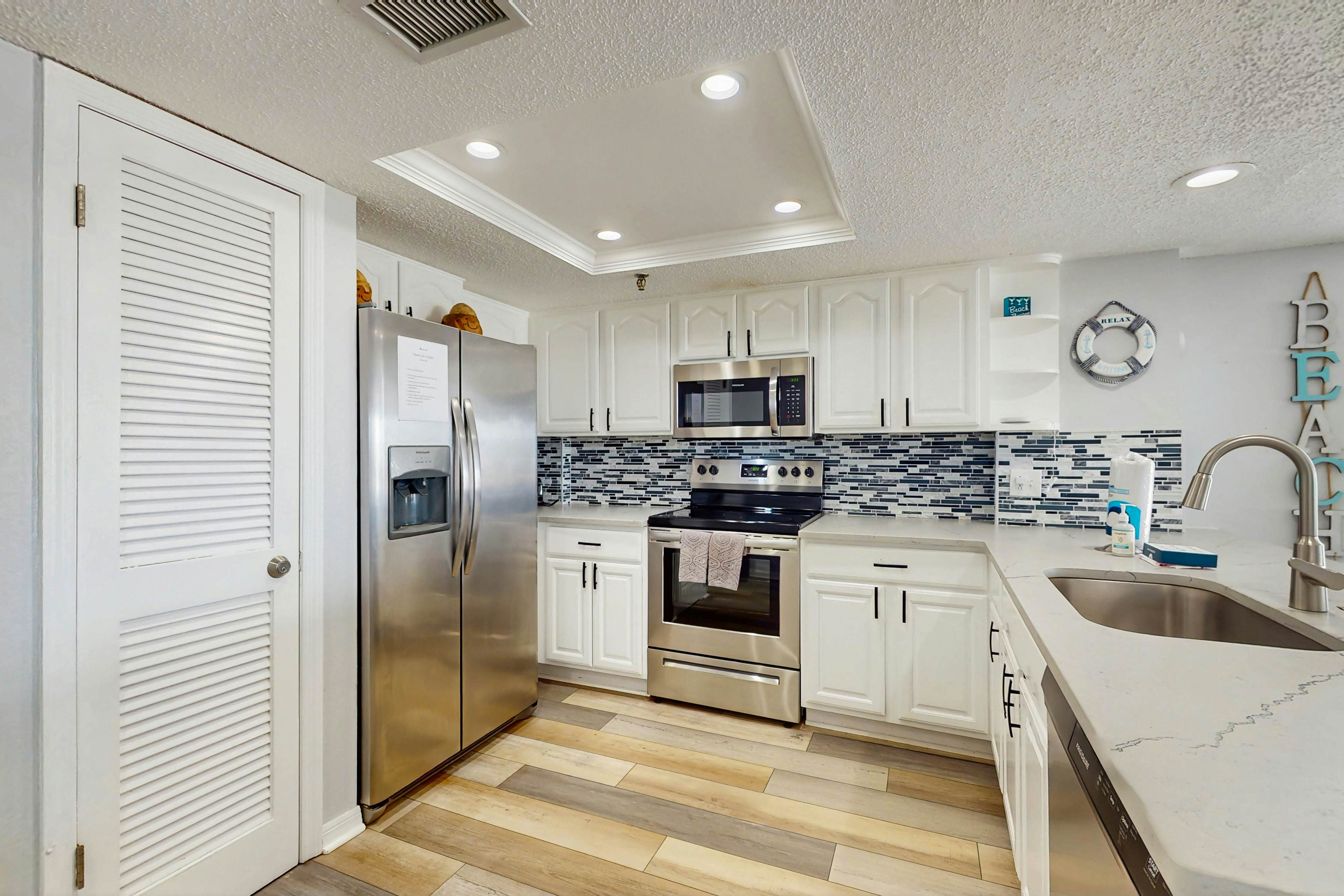 Newly renovated condo w/private balcony, gas grill, & on-site heated pool, AC