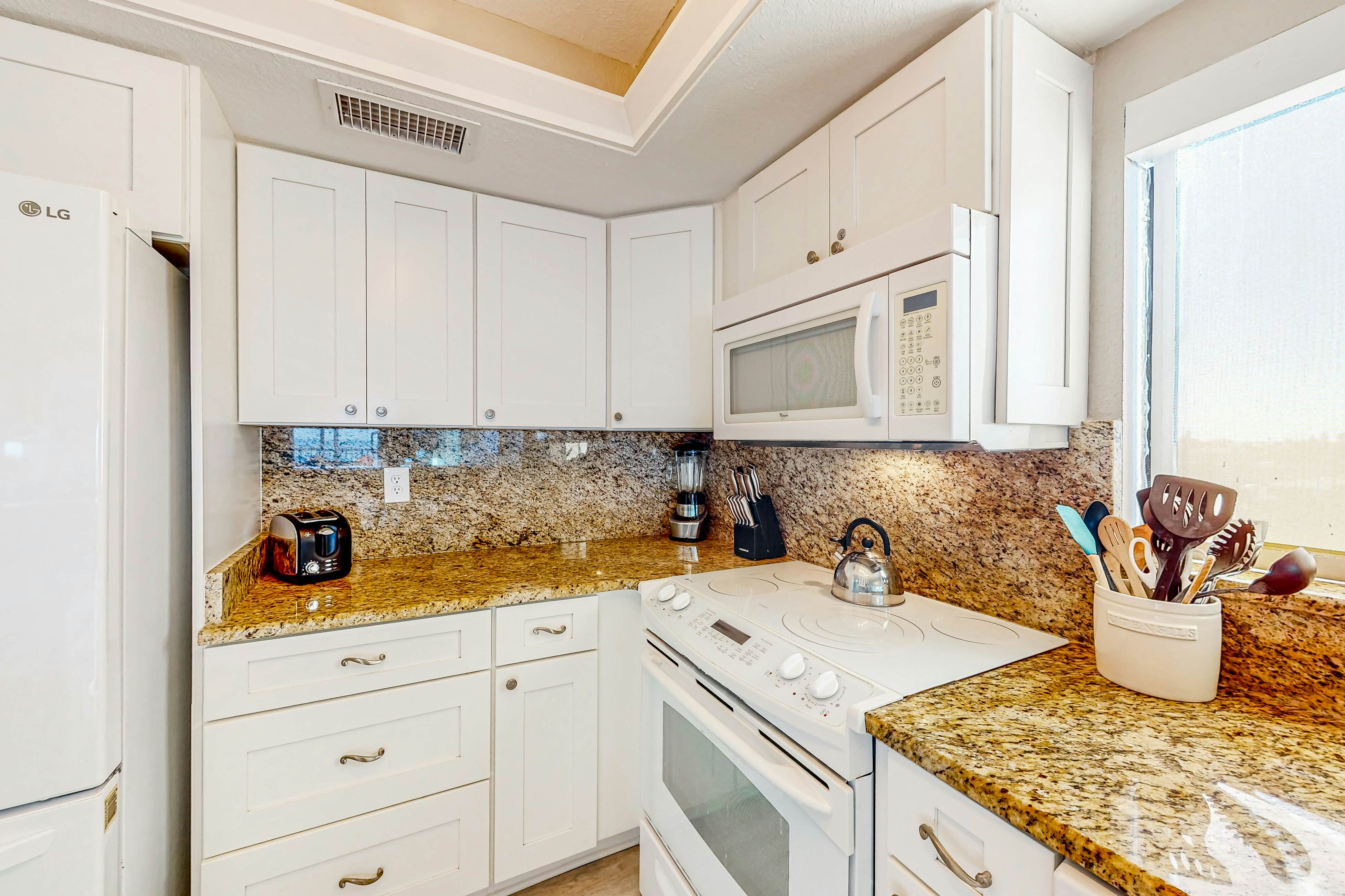 Renovated beachfront condo with pool, amazing Gulf views & washer/dryer