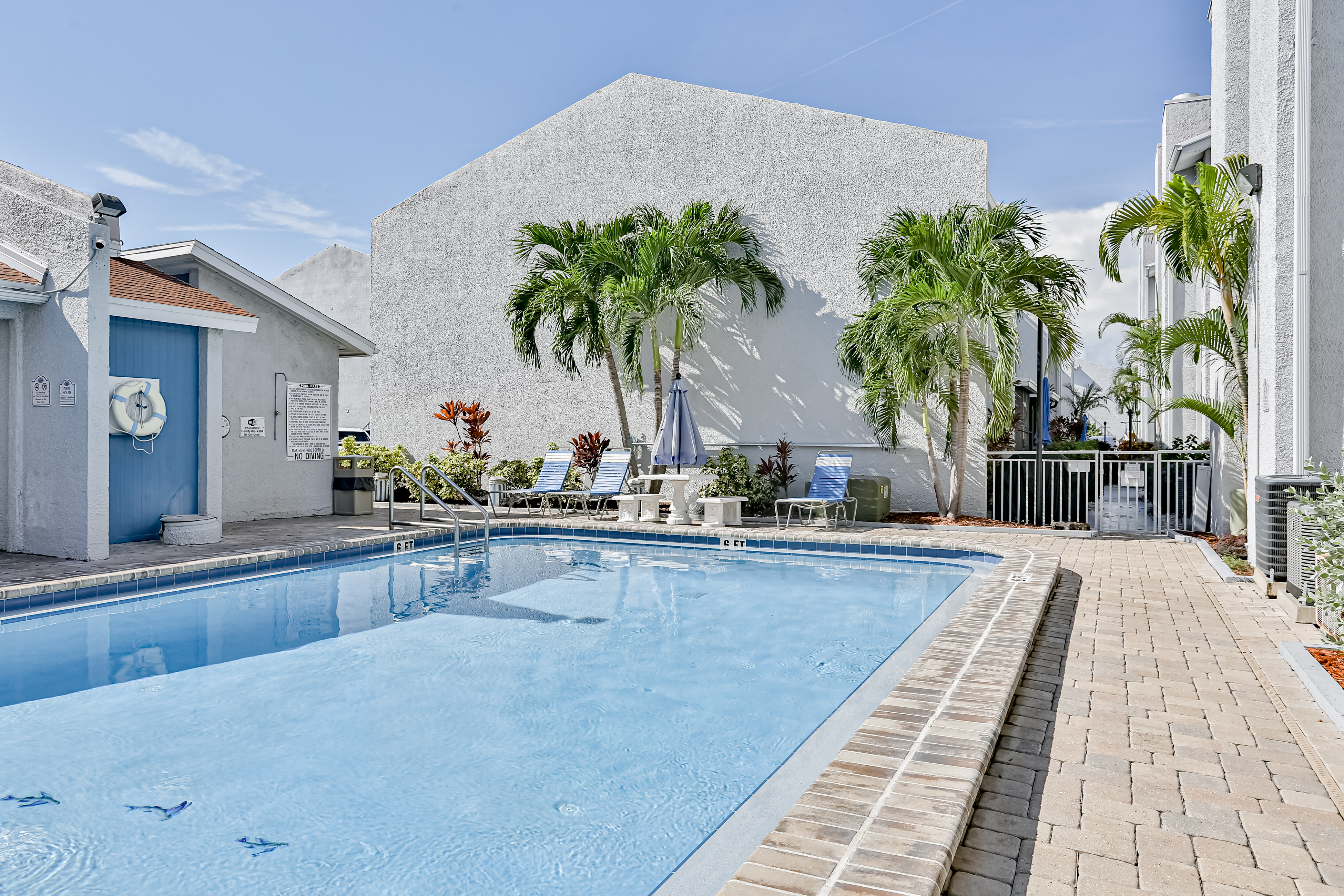 Water view condo with balcony heated pool and WD walk to beach