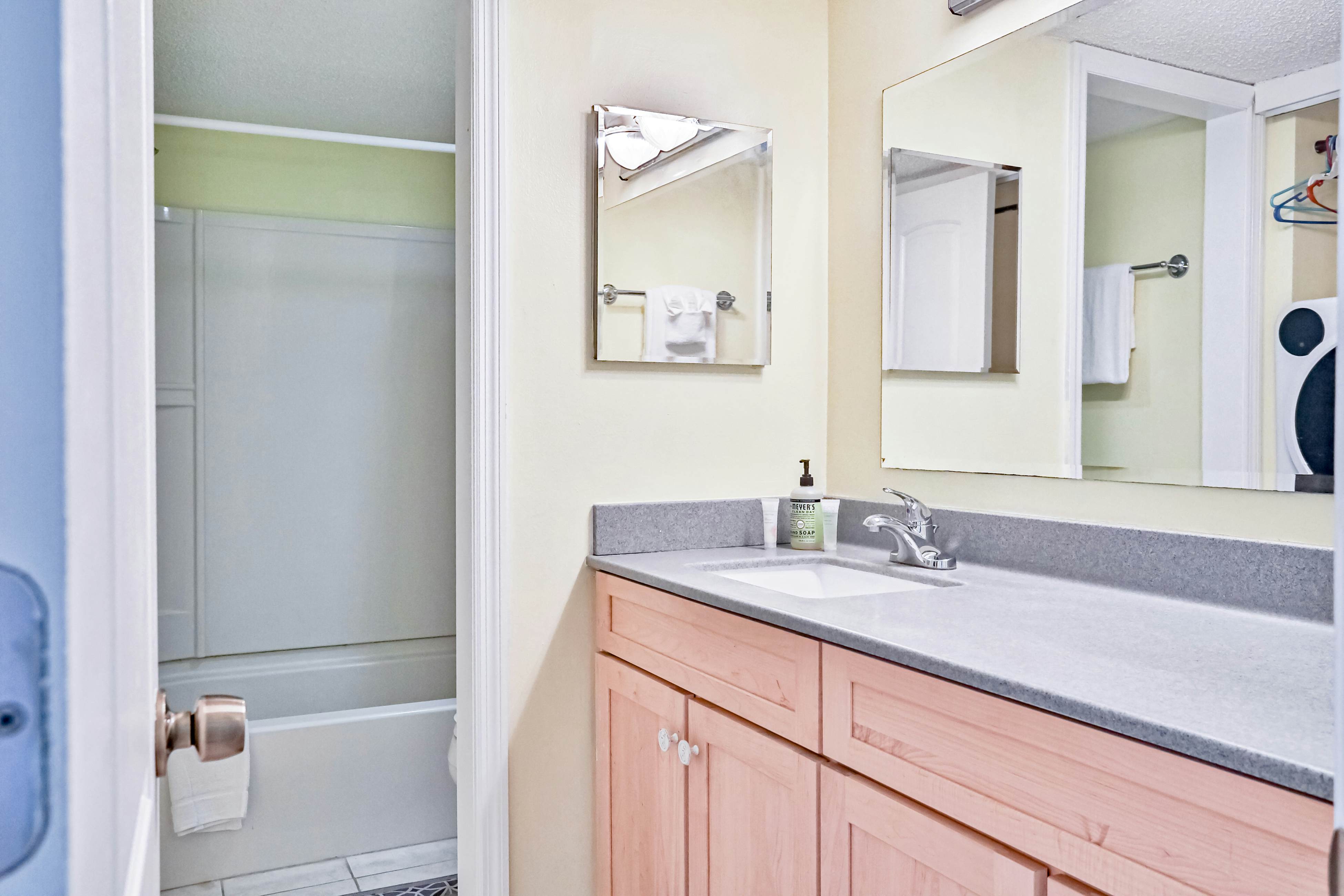 Water-view condo with balcony, pool & W/D - walk to beach