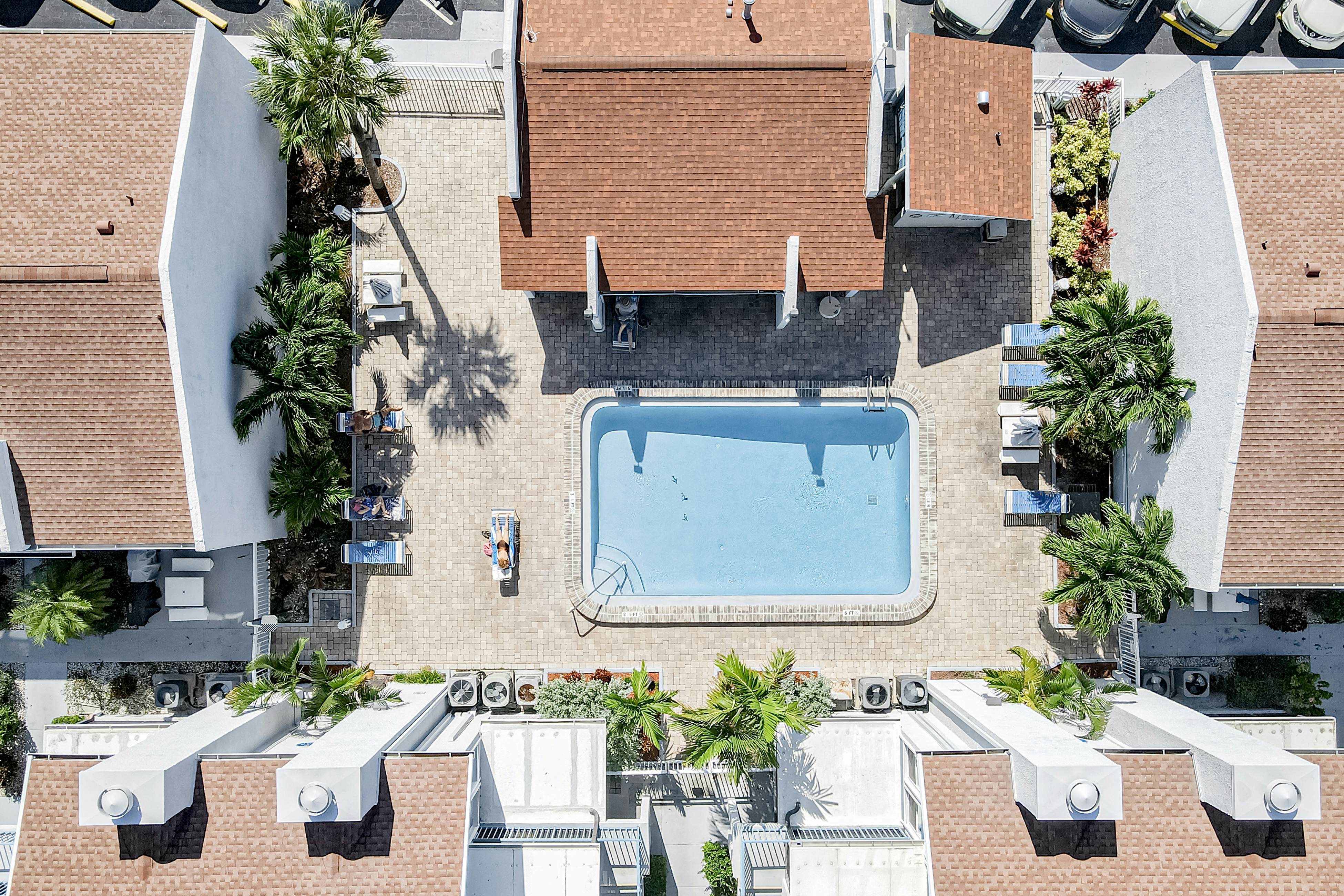 Water-view condo with balcony, pool & W/D - walk to beach