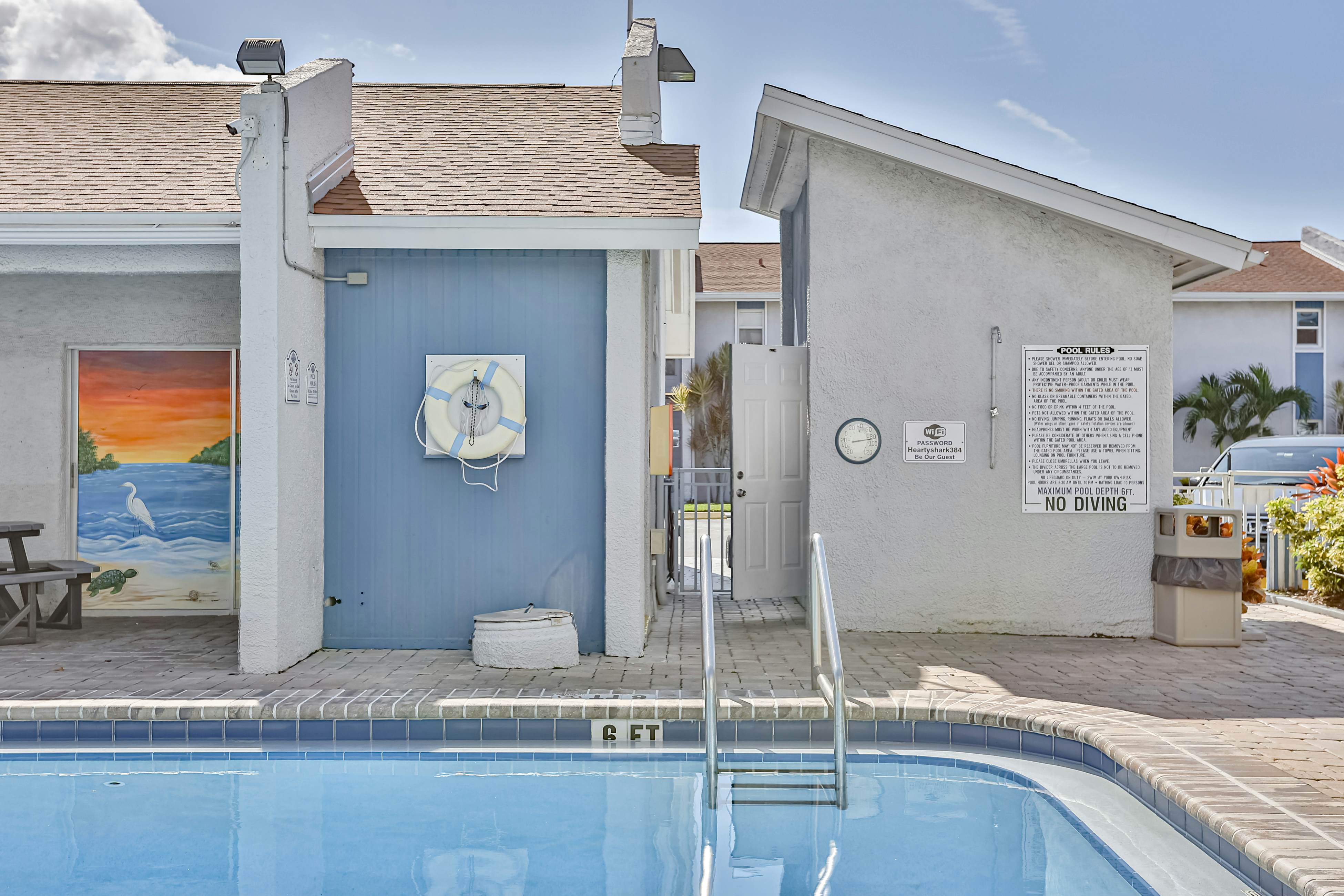 Water-view condo with balcony, pool & W/D - walk to beach