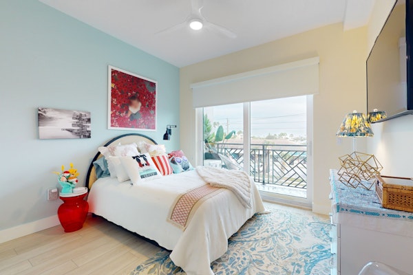 Sunlit and colorful beach condo with heated pool hot tub and balcony near shore and shops