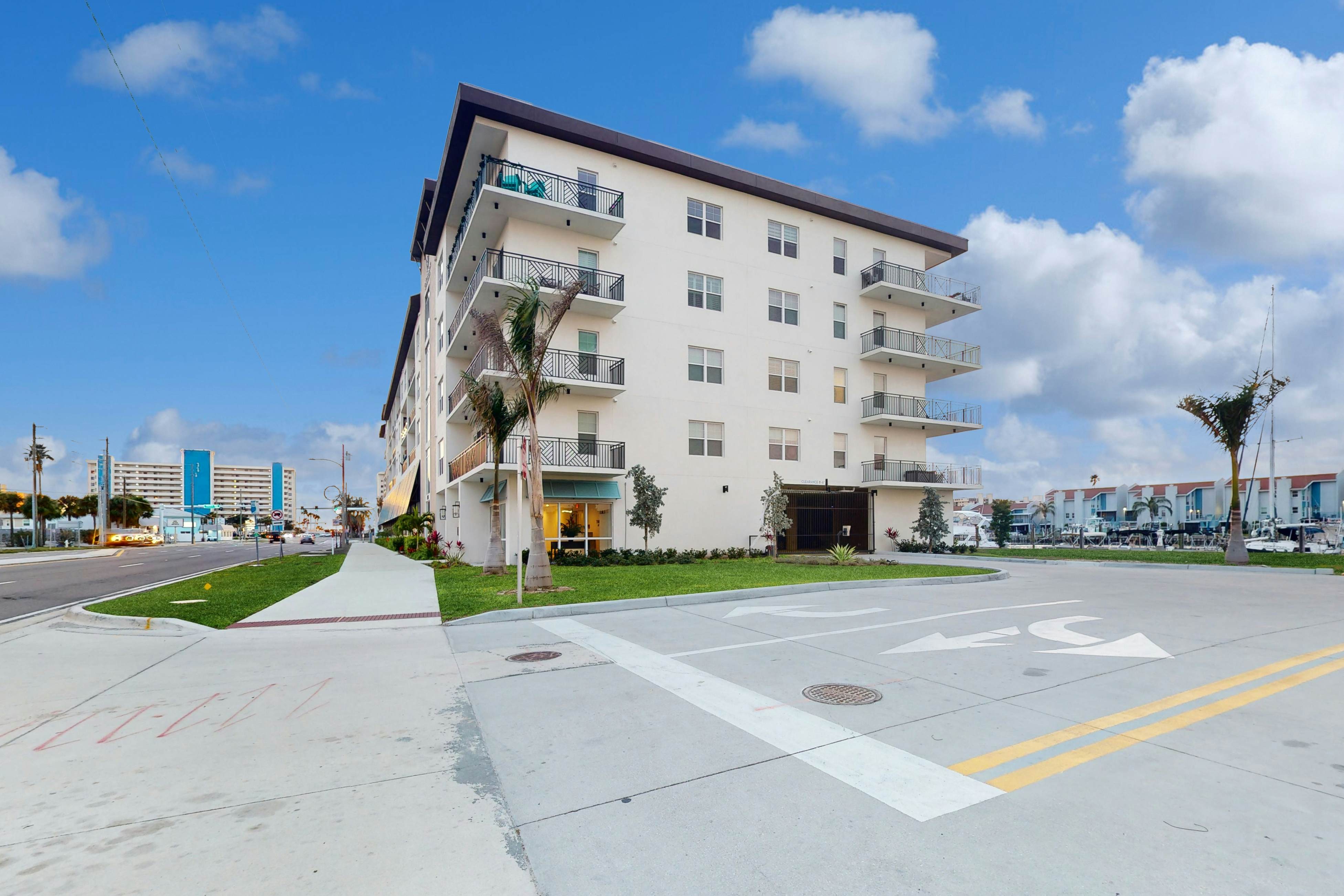 Sunlit & colorful beach condo with pool, hot tub, & balcony - near shore & shops
