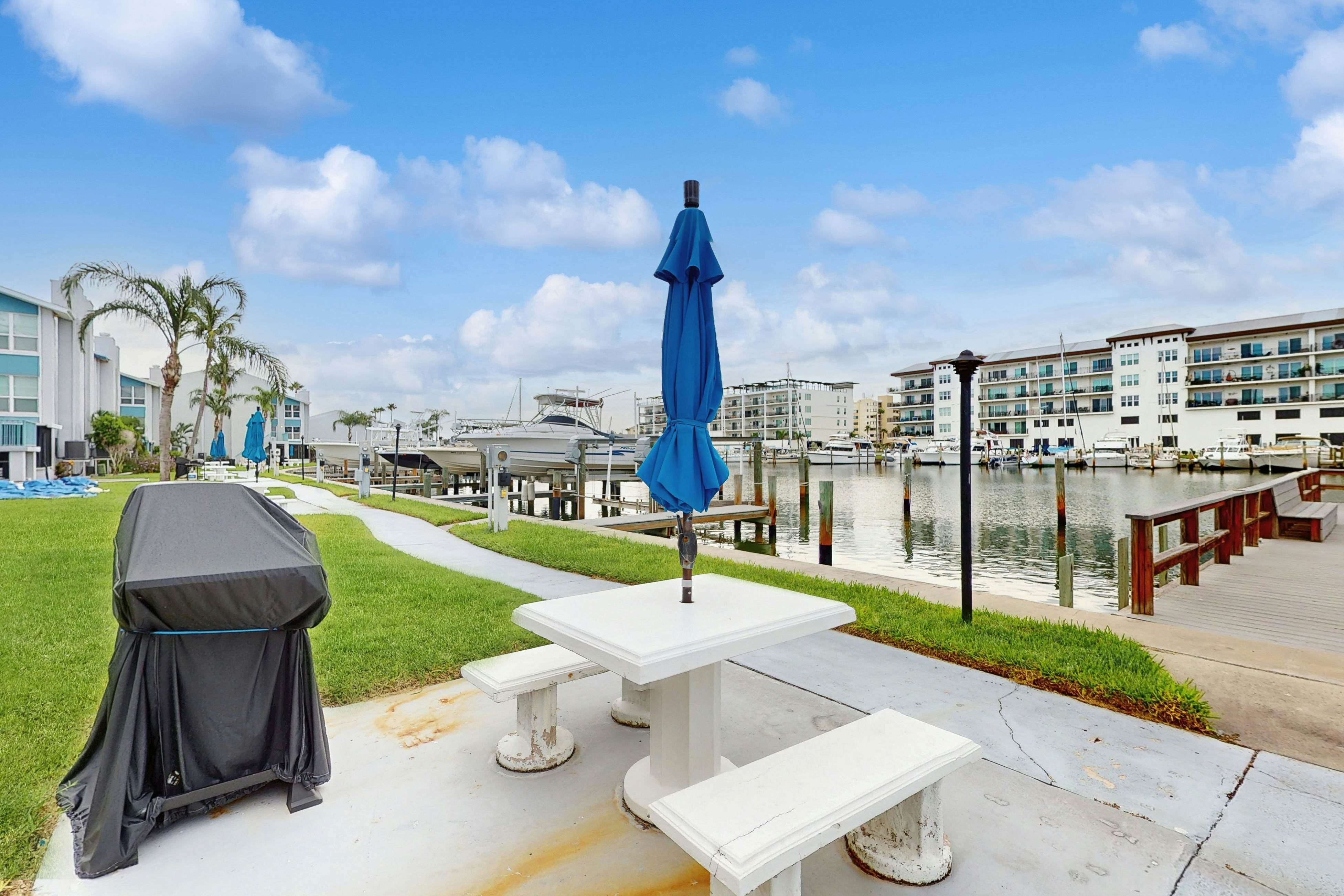 Water-view condo with balcony, grill, heated pool, hot tub, & sauna - walk to beach