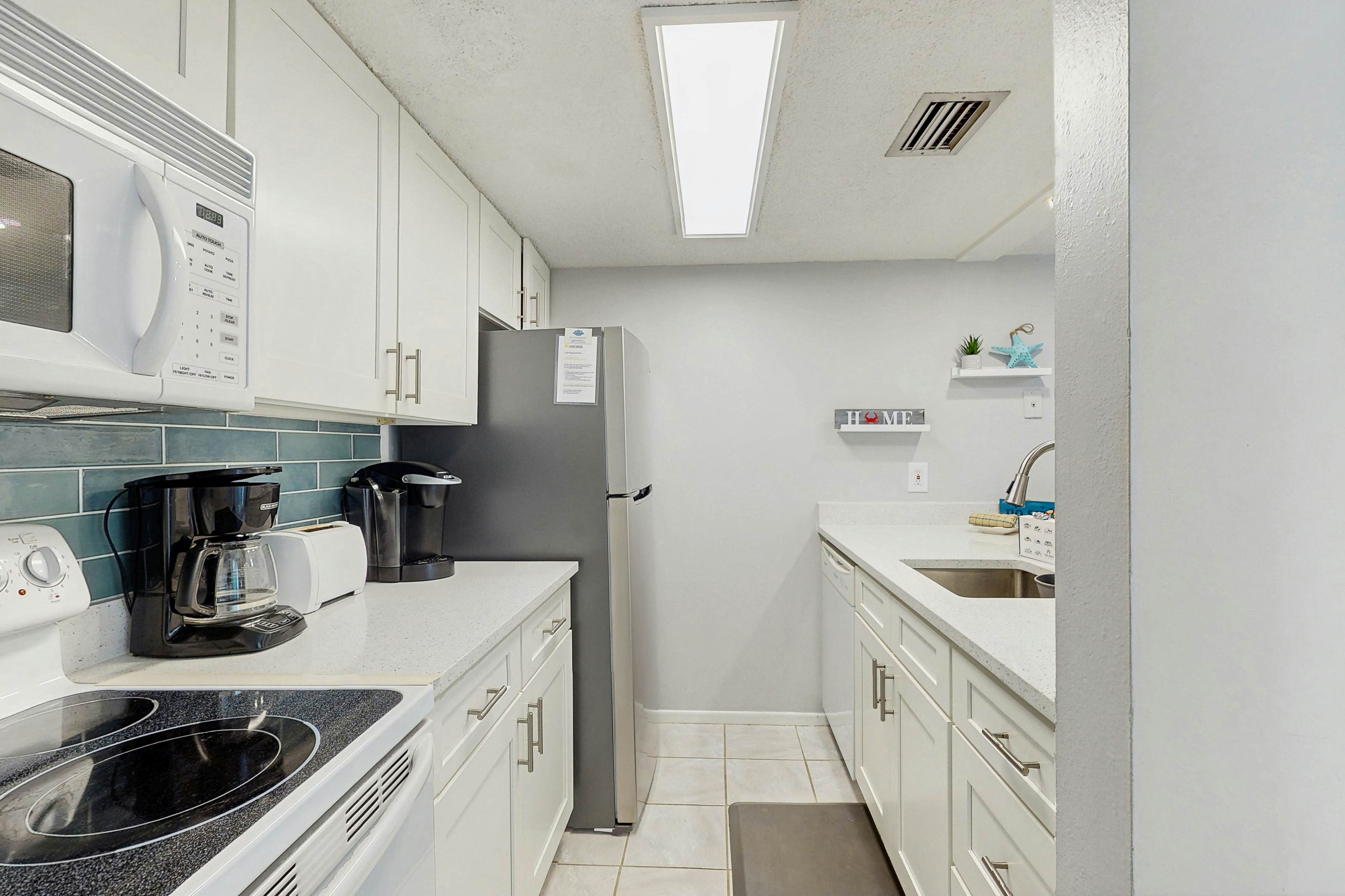 Water-view condo with balcony, grill, heated pool, hot tub, & sauna - walk to beach