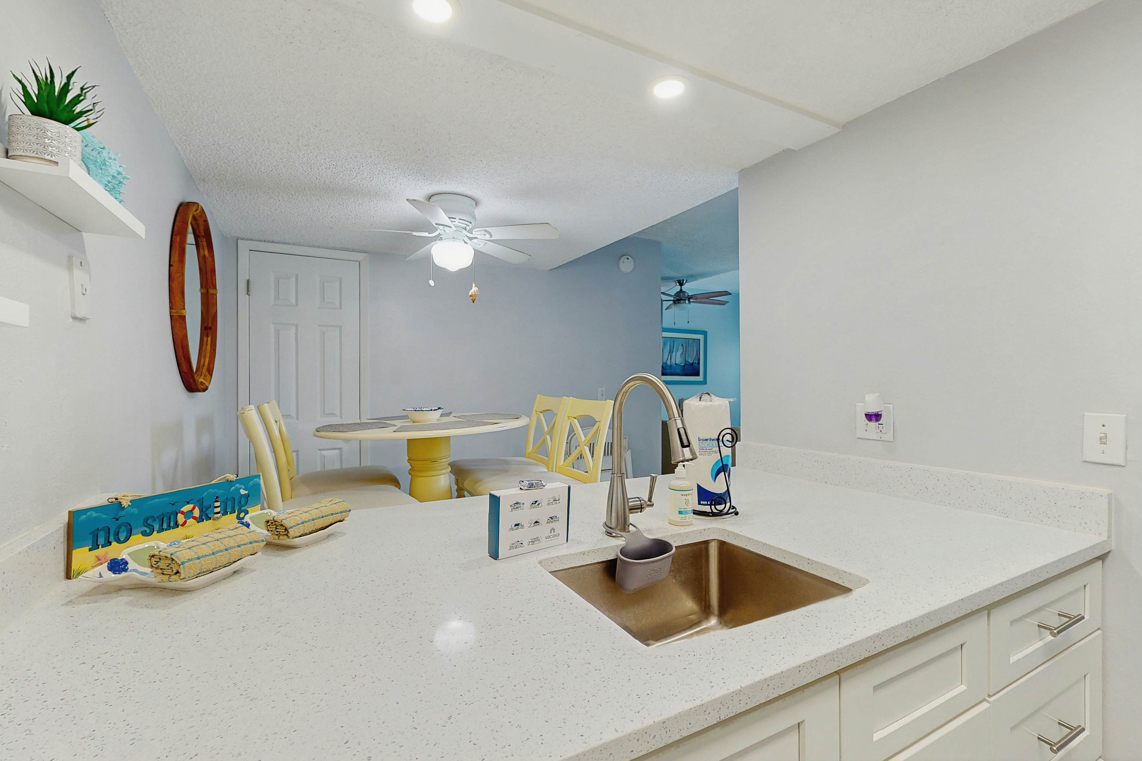 Water-view condo with balcony, grill, heated pool, hot tub, & sauna - walk to beach