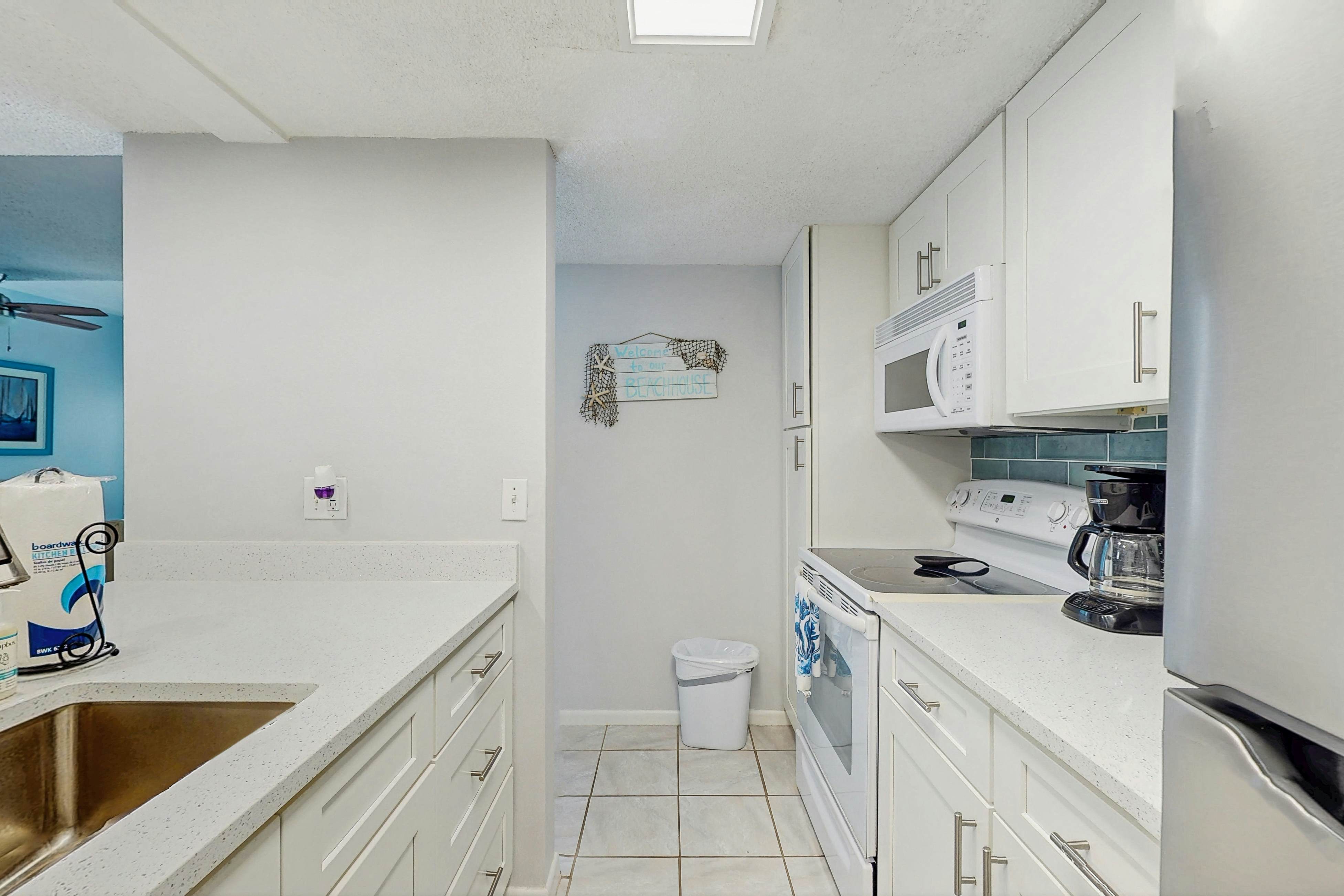 Water-view condo with balcony, grill, heated pool, hot tub, & sauna - walk to beach