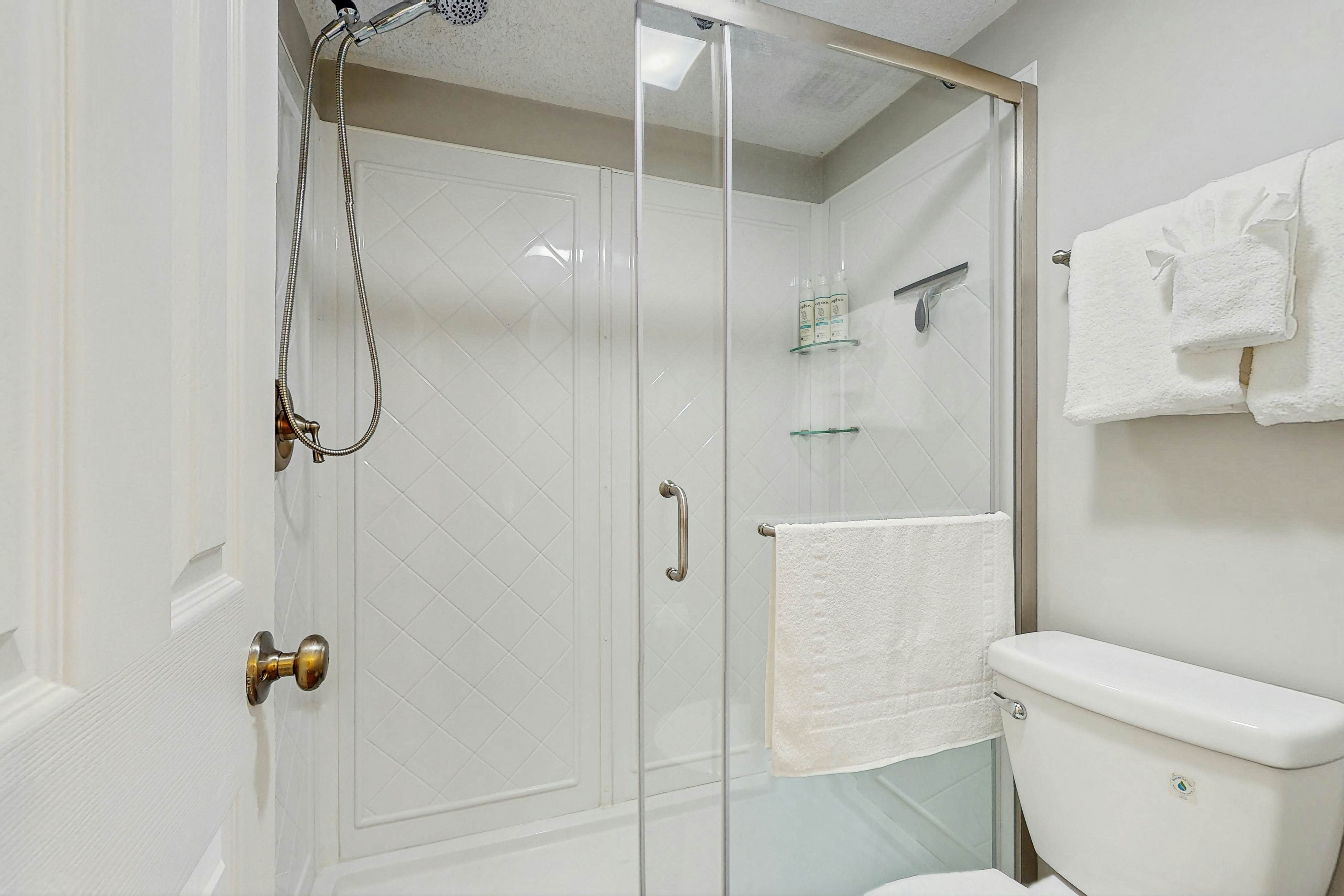 Water-view condo with balcony, grill, heated pool, hot tub, & sauna - walk to beach