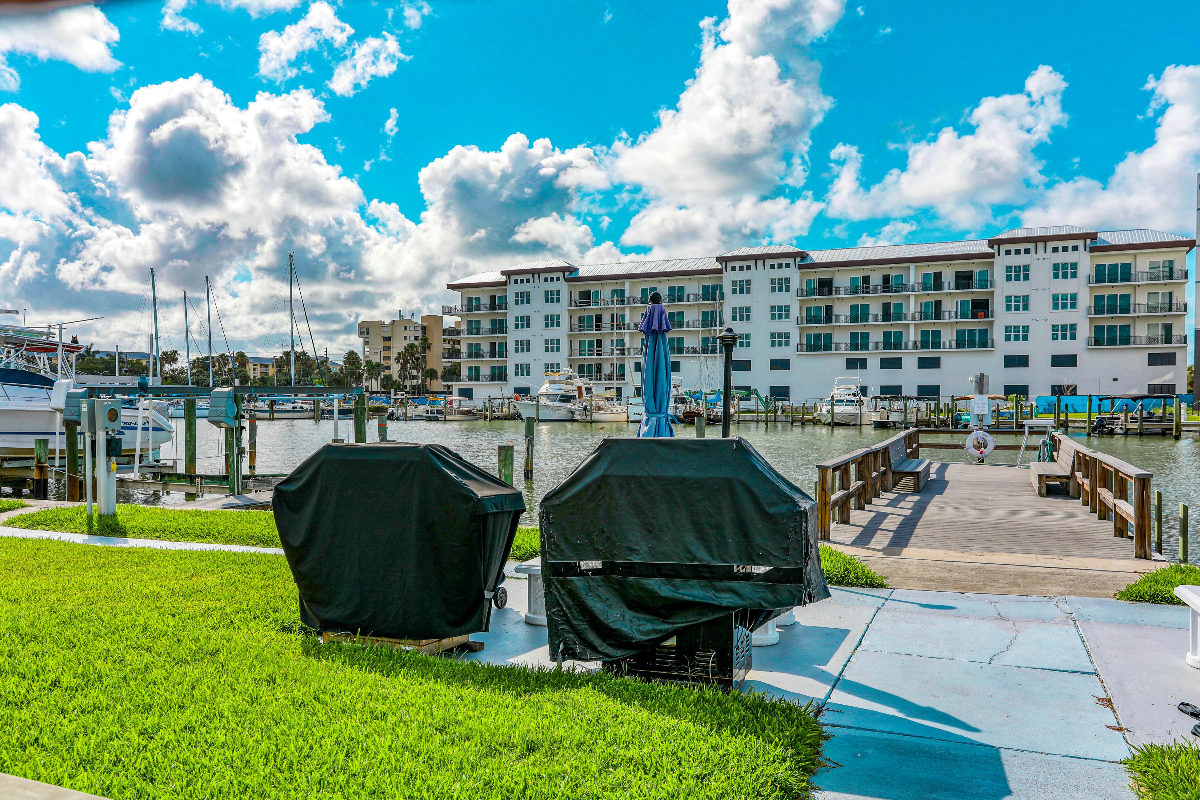 Water-view condo with balcony, grill, heated pool, hot tub, & sauna - walk to beach