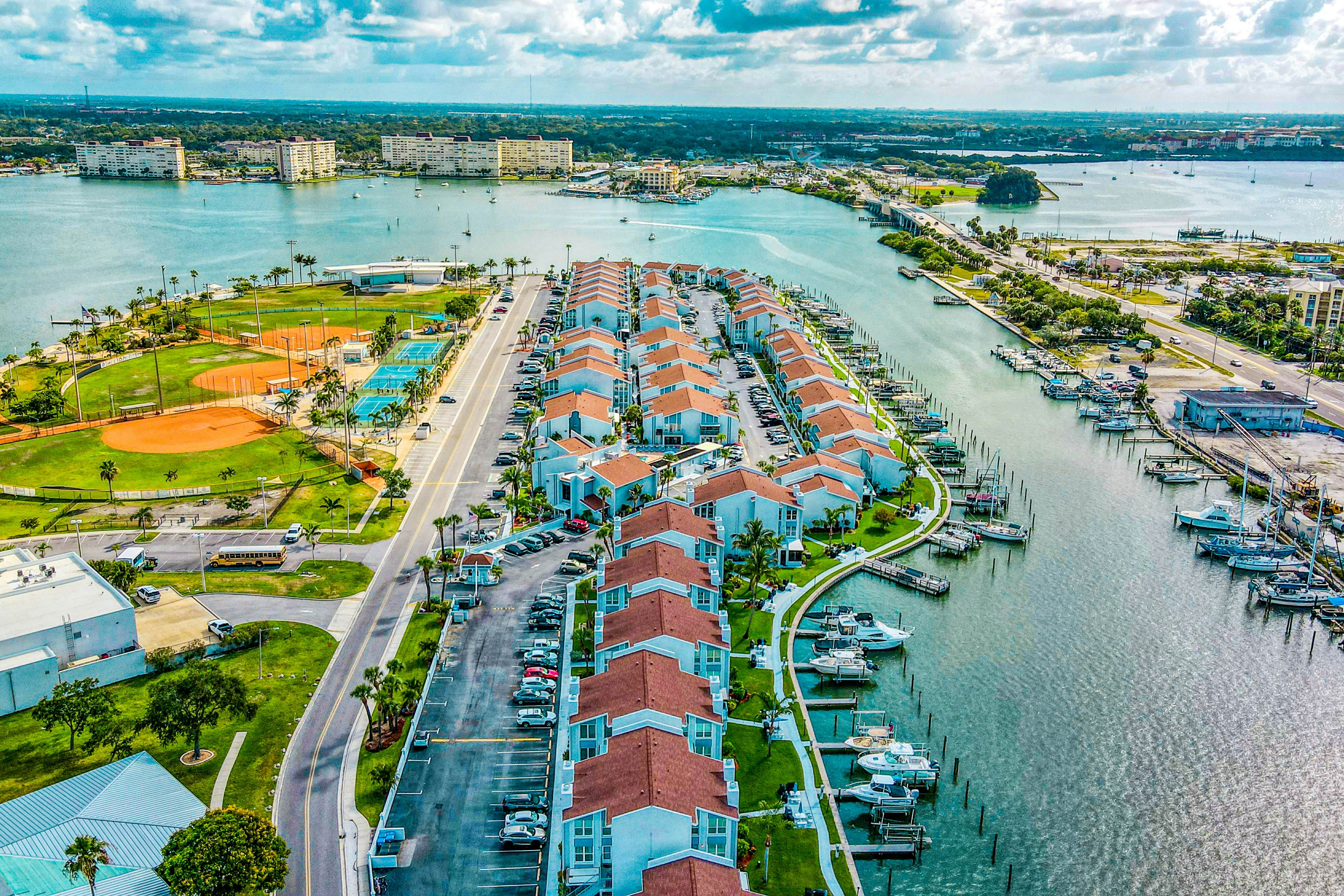 Water-view condo with balcony, grill, heated pool, hot tub, & sauna - walk to beach