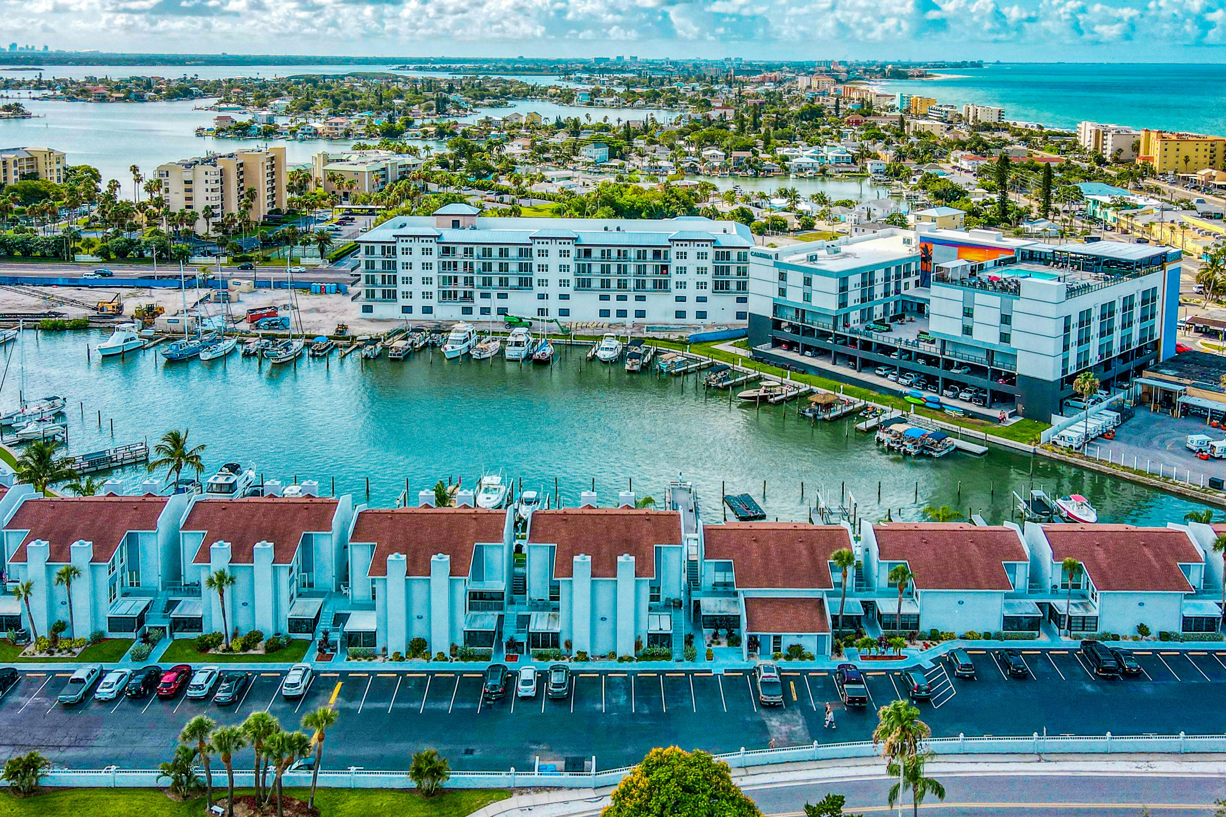 Water-view condo with balcony, grill, heated pool, hot tub, & sauna - walk to beach