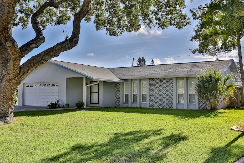 Modern coastal getaway with pool enclosed yard grill and outdoor bar