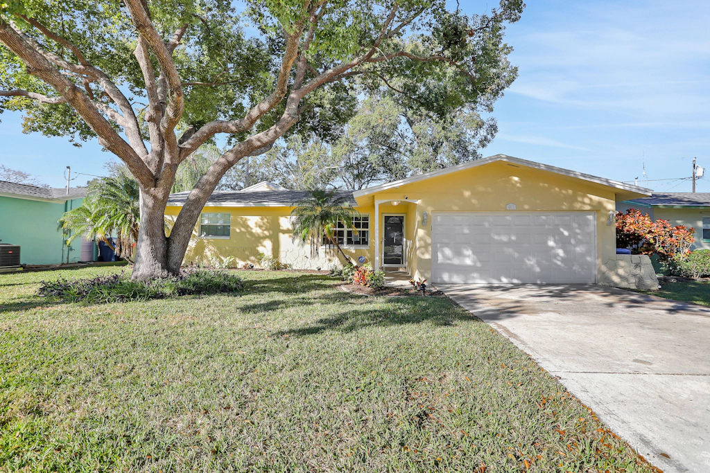 Stunning centrally located home with enclosed yard patio grill WD and AC