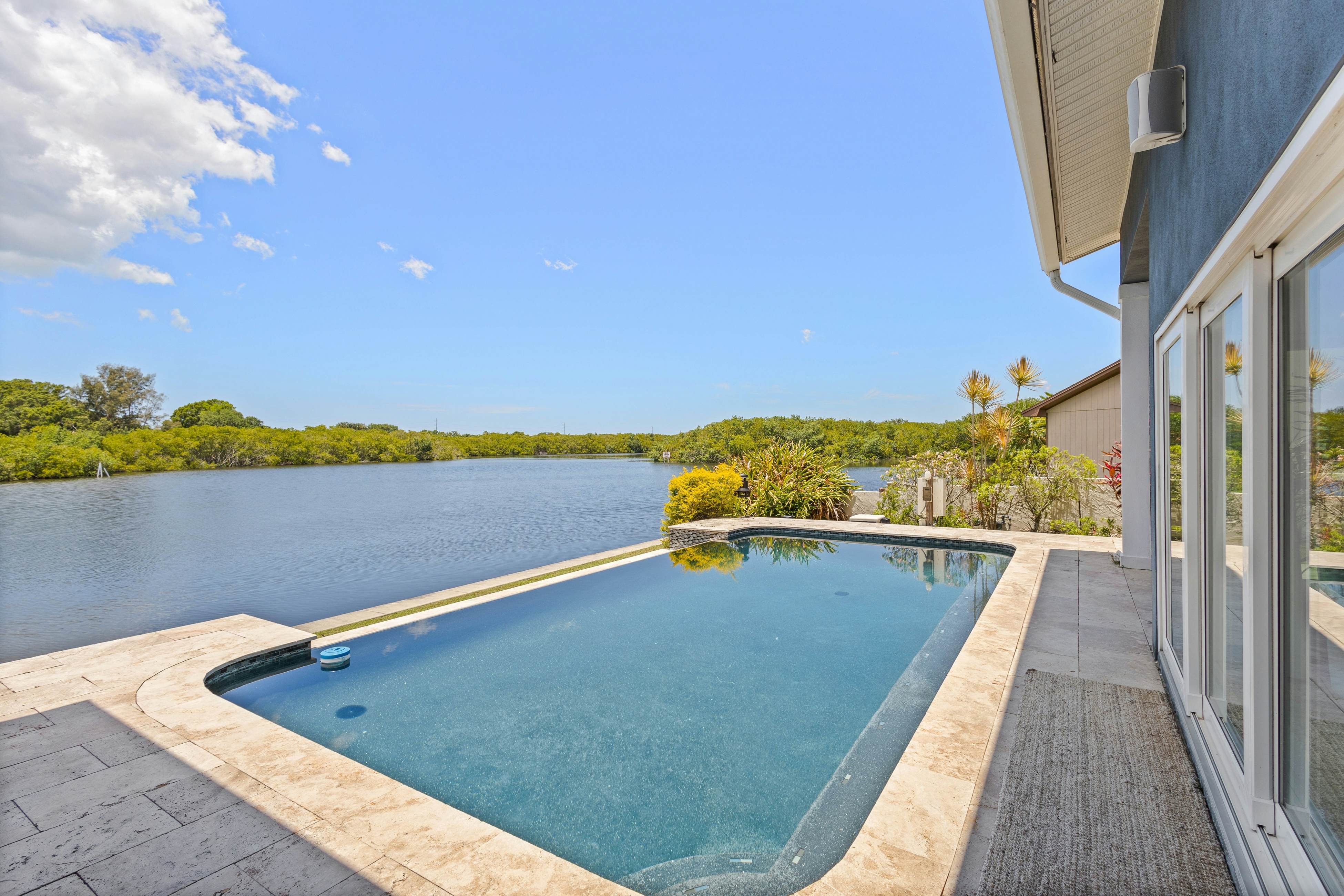 Modern indulgence with media room, expansive waterway views, AC, WD and Wifi