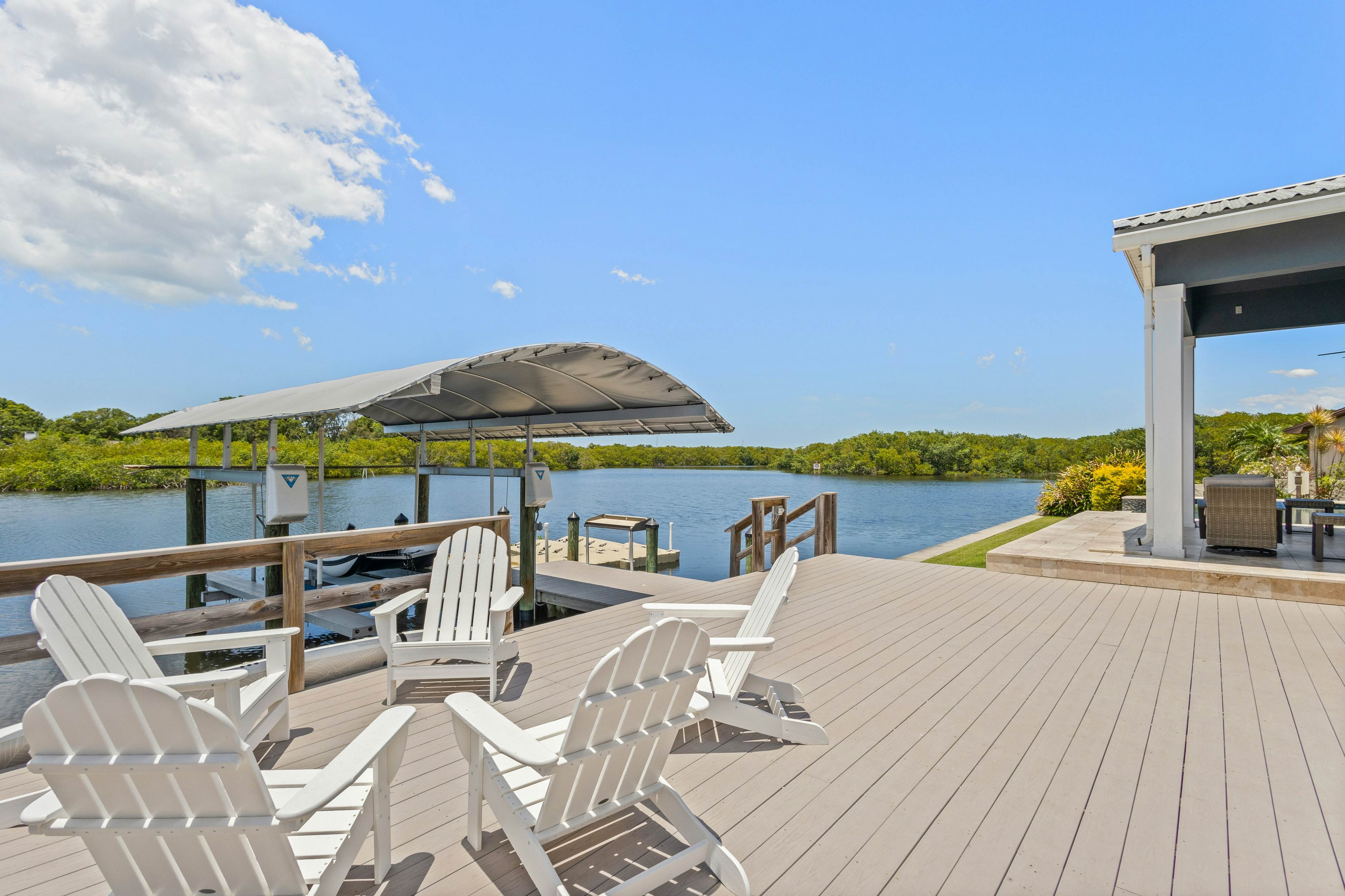 Modern indulgence with media room, expansive waterway views, AC, WD and Wifi