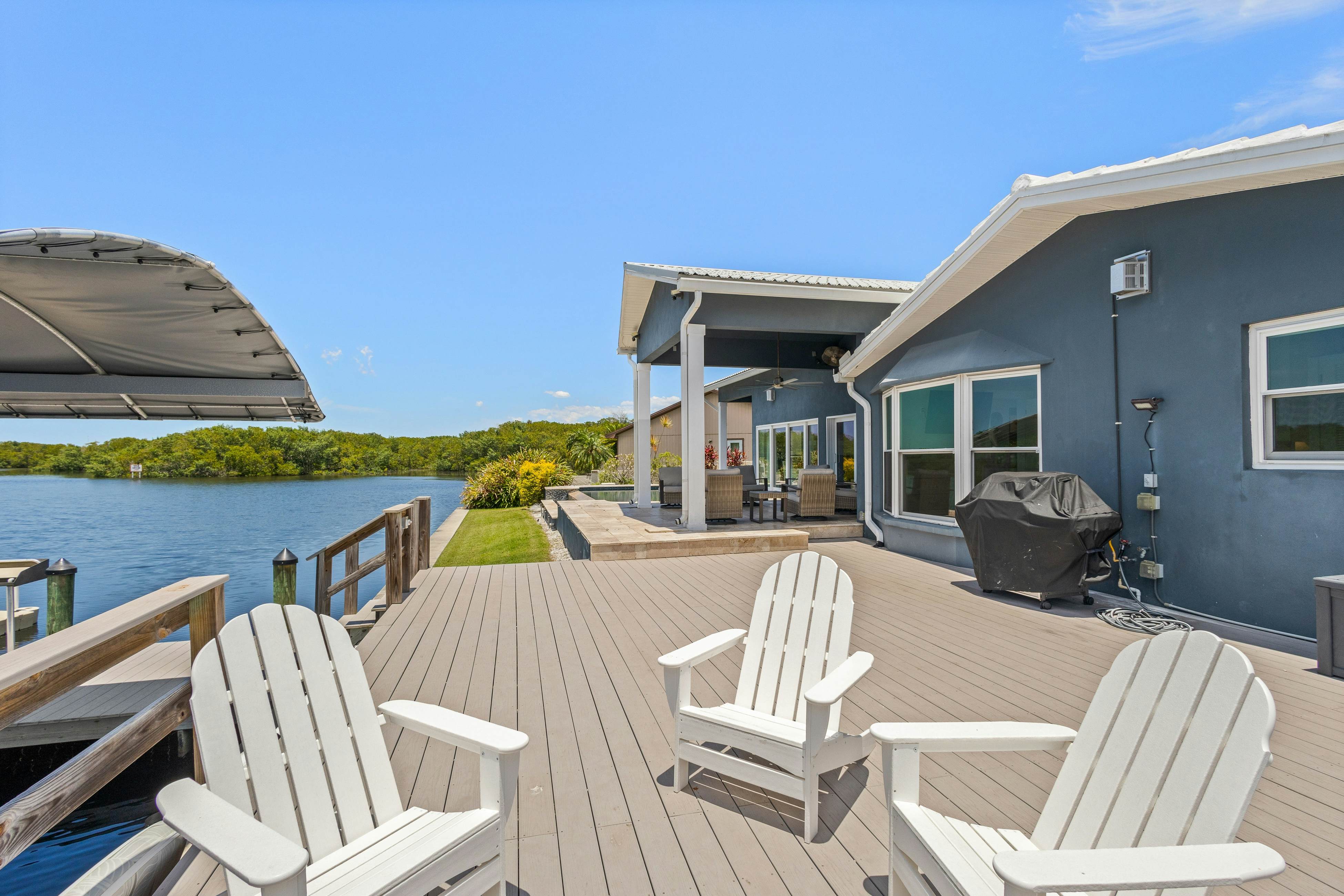 Modern indulgence with media room, expansive waterway views, AC, WD and Wifi