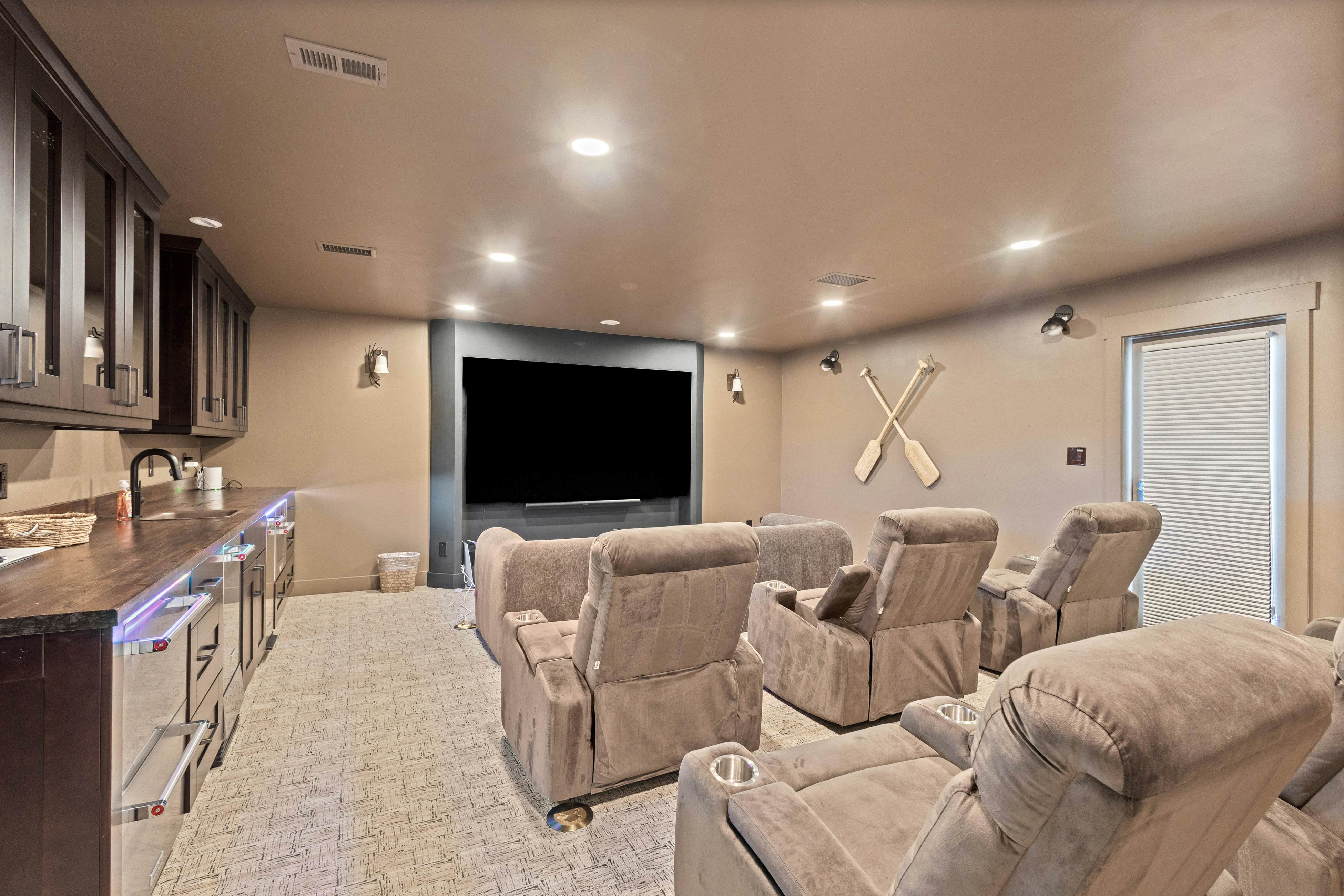 Modern indulgence with media room, expansive waterway views, AC, WD and Wifi