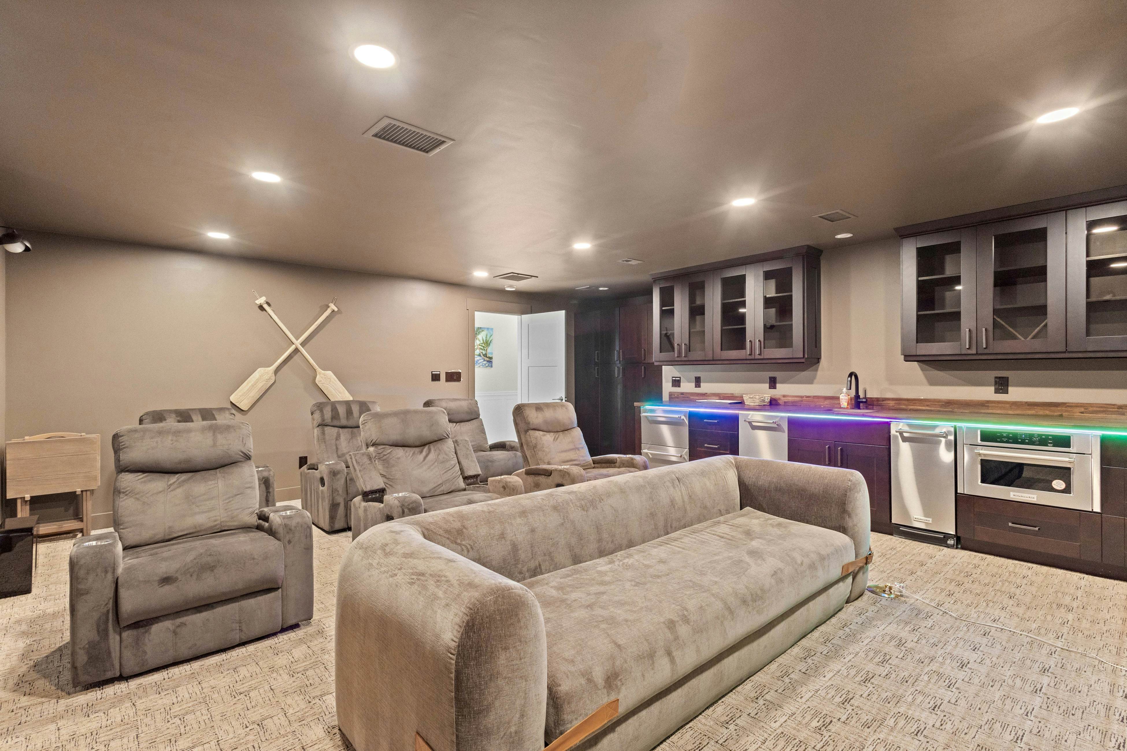 Modern indulgence with media room, expansive waterway views, AC, WD and Wifi