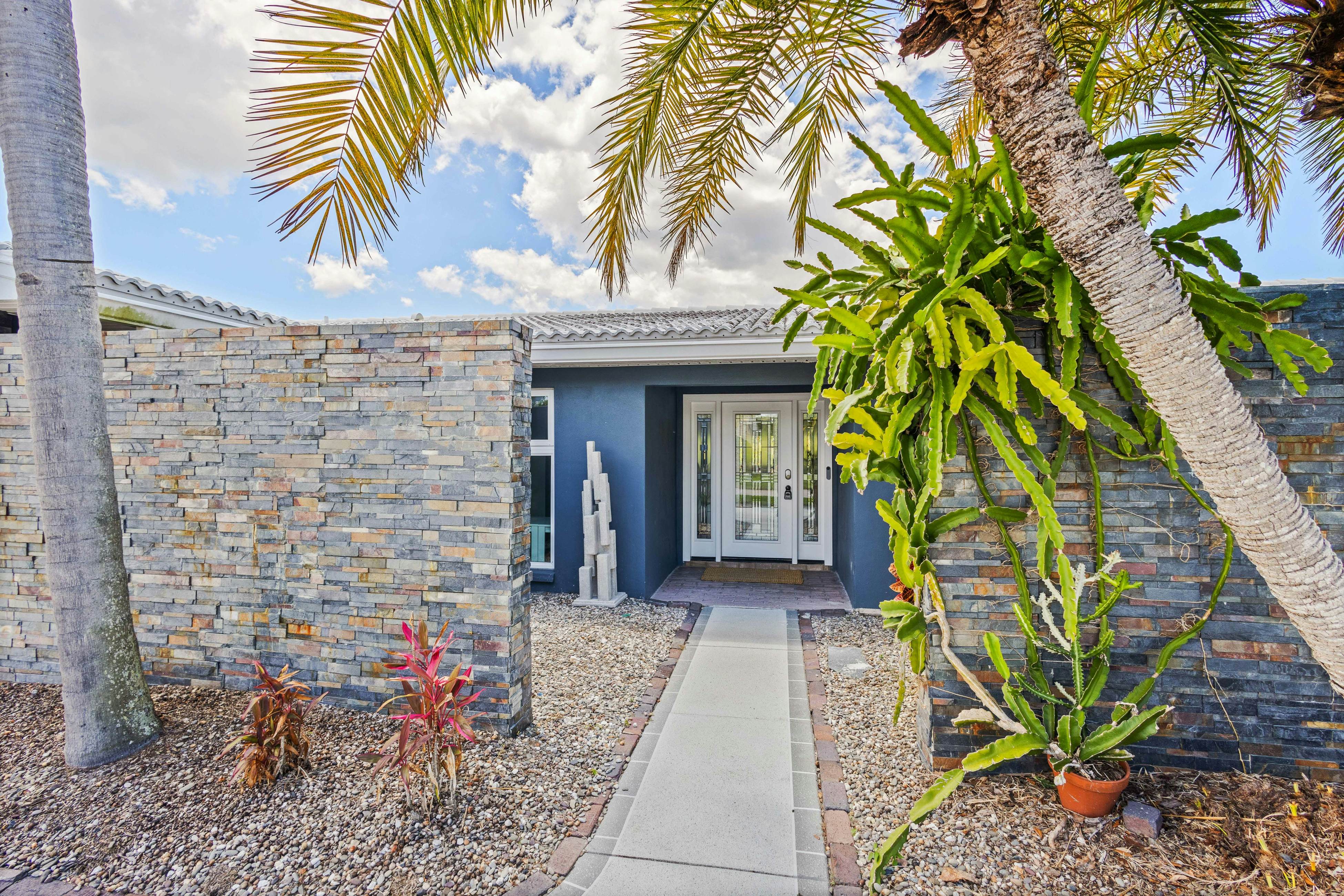 Modern indulgence with media room, expansive waterway views, AC, WD and Wifi