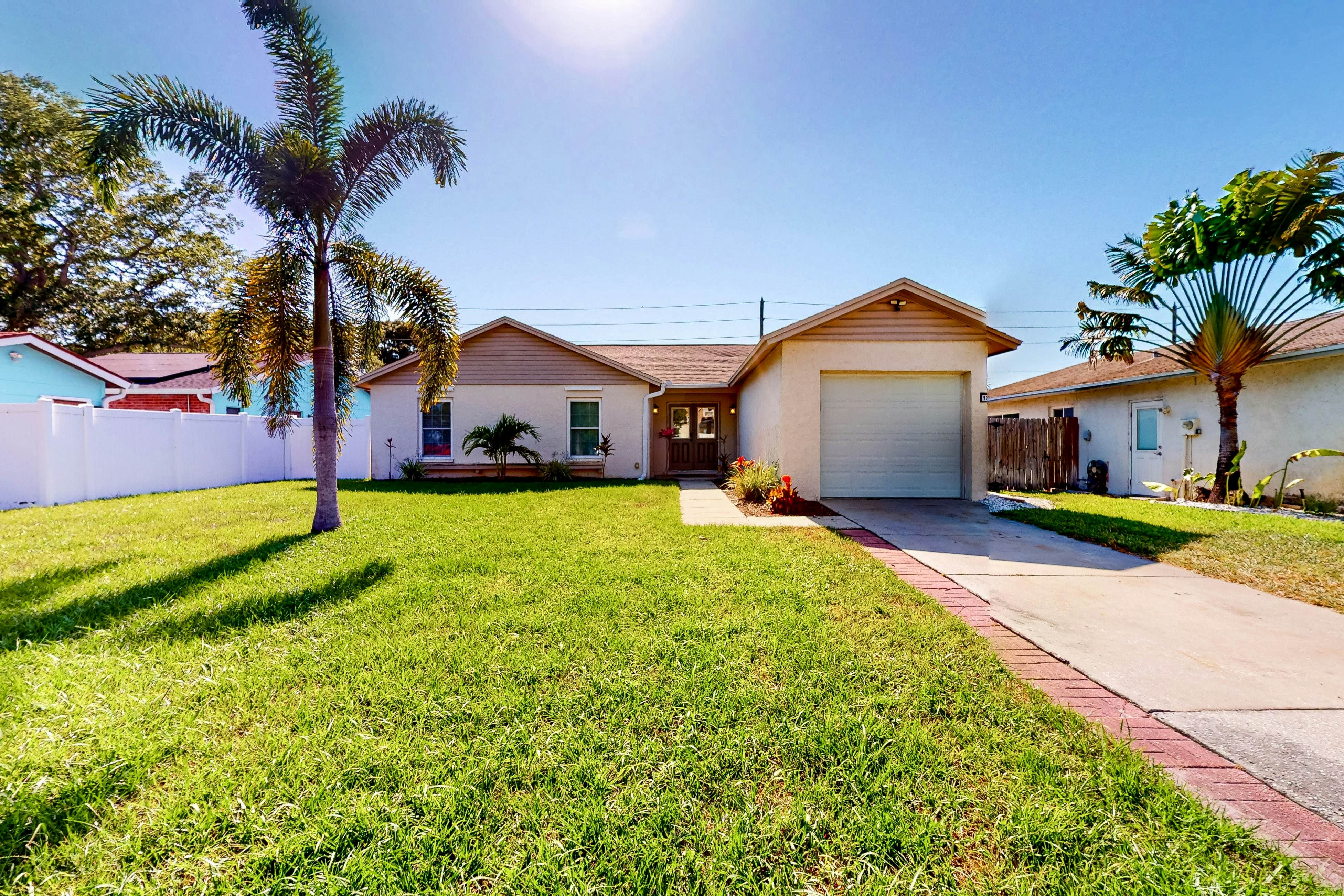 Dog-friendly house with patio, firepit, fenced yard, beach gear, & AC