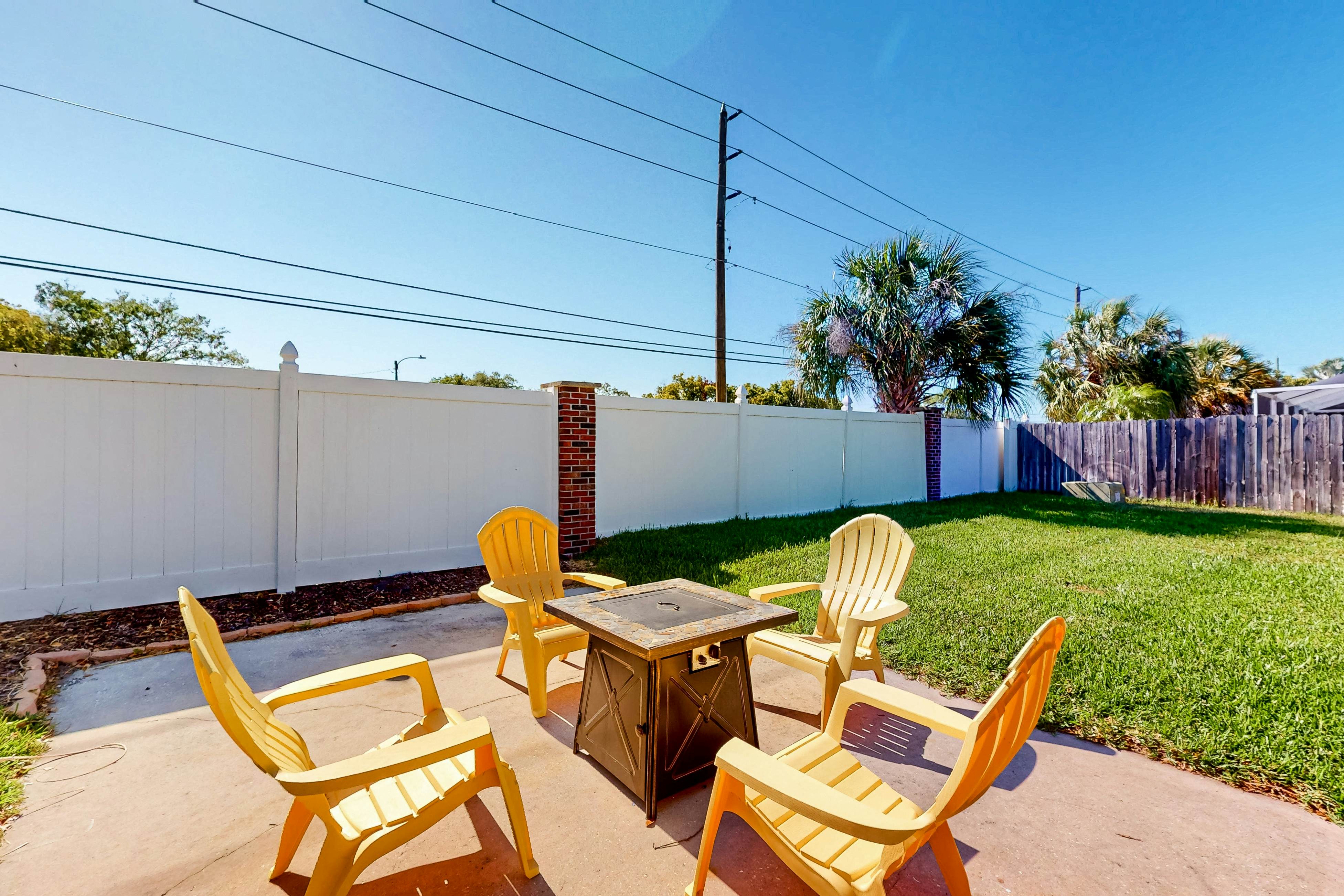 Dog-friendly house with patio, firepit, fenced yard, beach gear, & AC