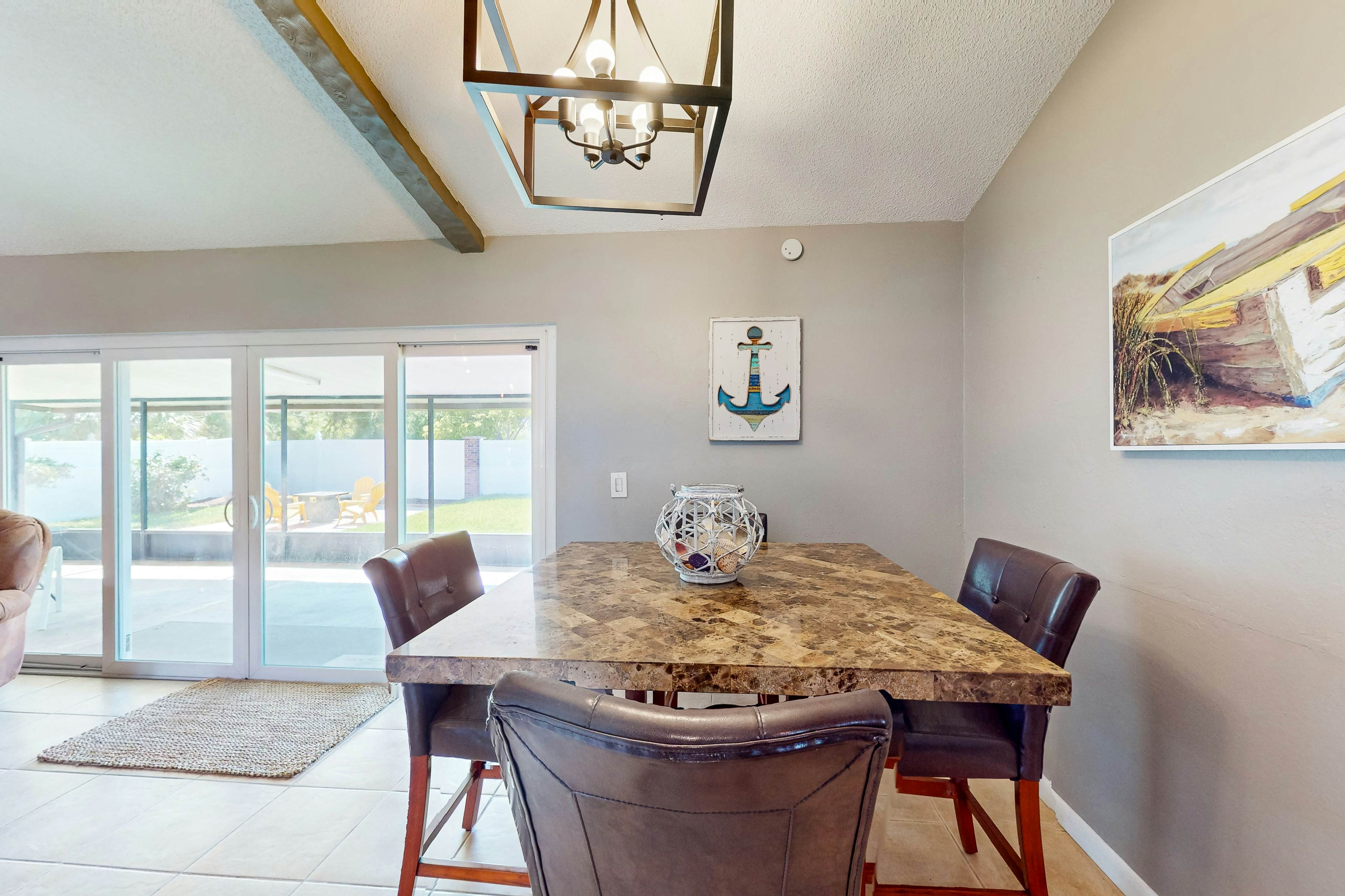 Dog-friendly house with patio, firepit, fenced yard, beach gear, & AC