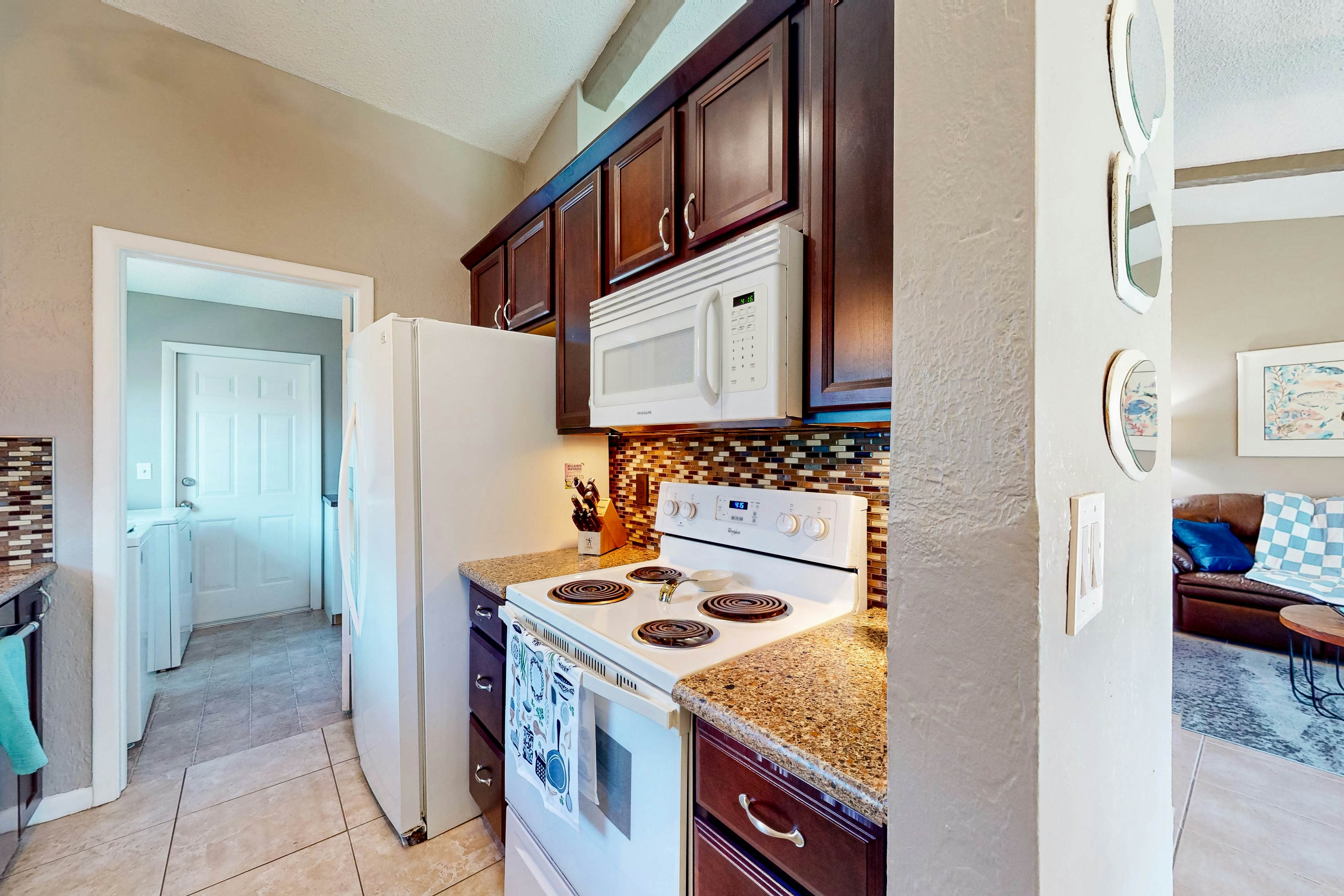 Dog-friendly house with patio, firepit, fenced yard, beach gear, & AC