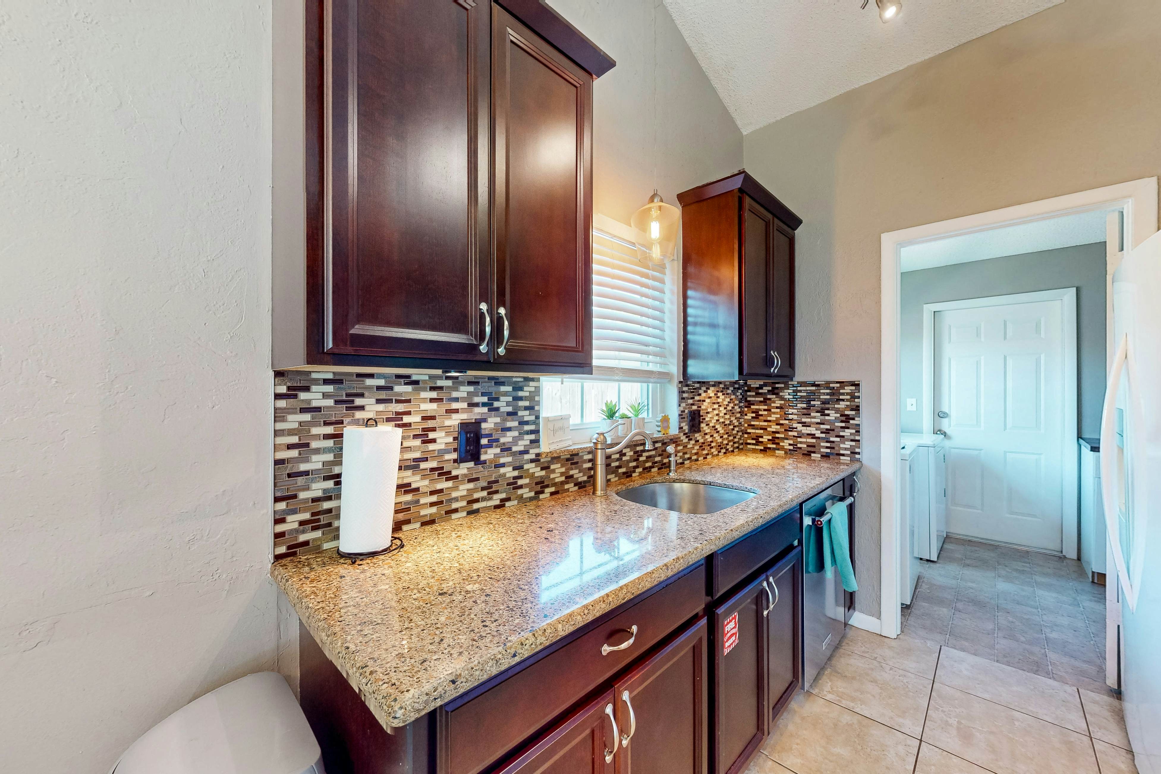 Dog-friendly house with patio, firepit, fenced yard, beach gear, & AC