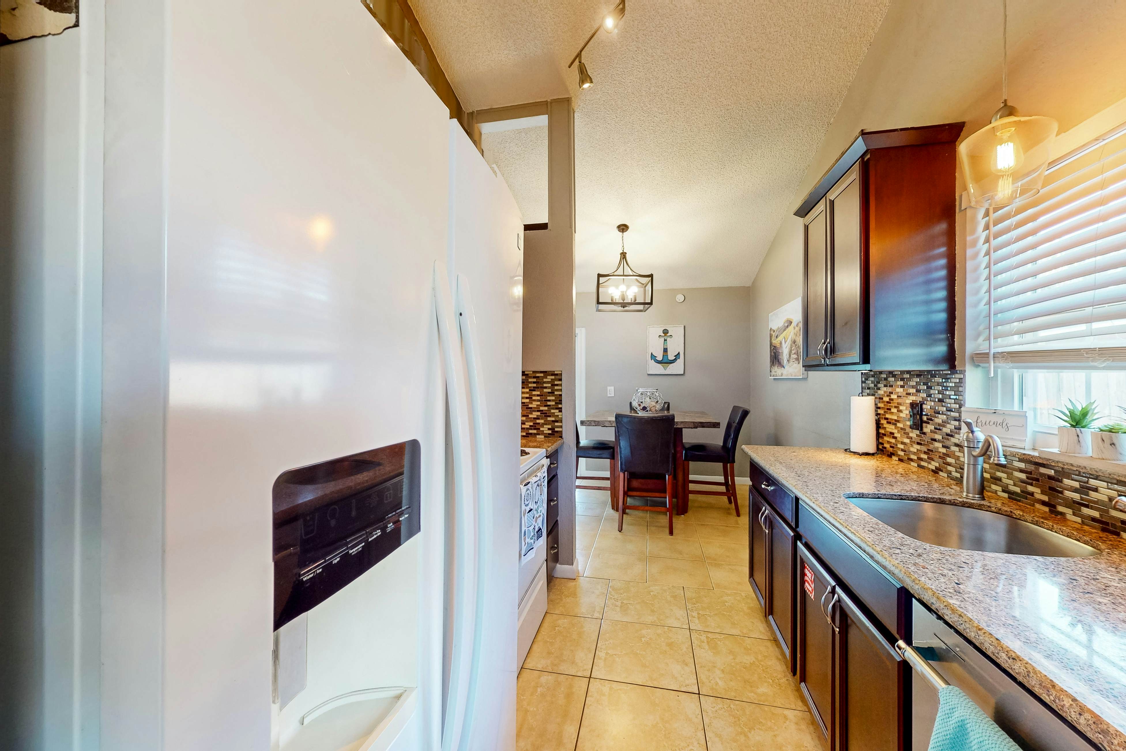 Dog-friendly house with patio, firepit, fenced yard, beach gear, & AC